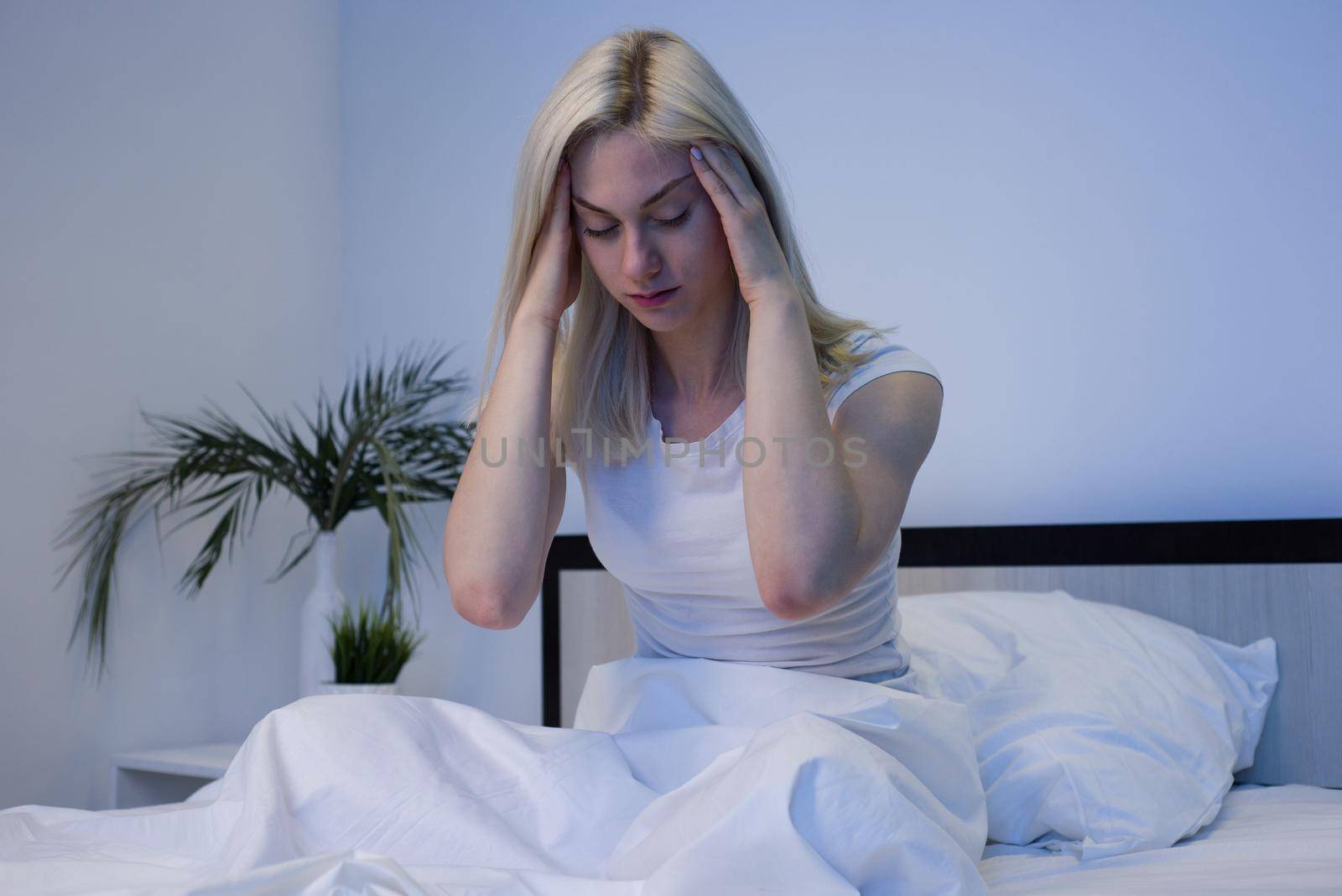 Depressed woman awake in the night, she is exhausted and suffering from insomnia - Image