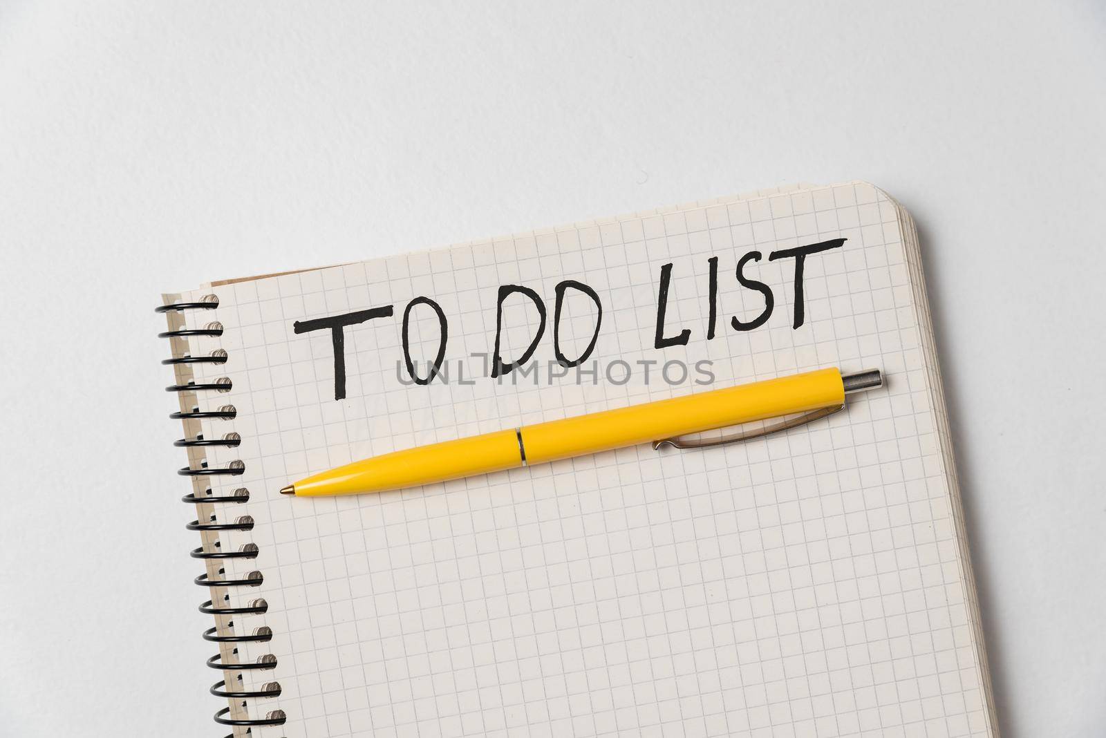 To do list. Notebook and colorful pen on white background. Handwritten, Top view.