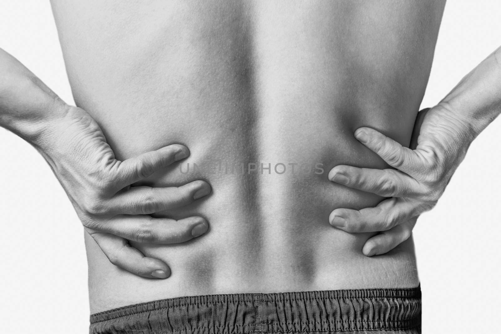 Acute pain in a male lower back. Monochrome image, isolated on a white background