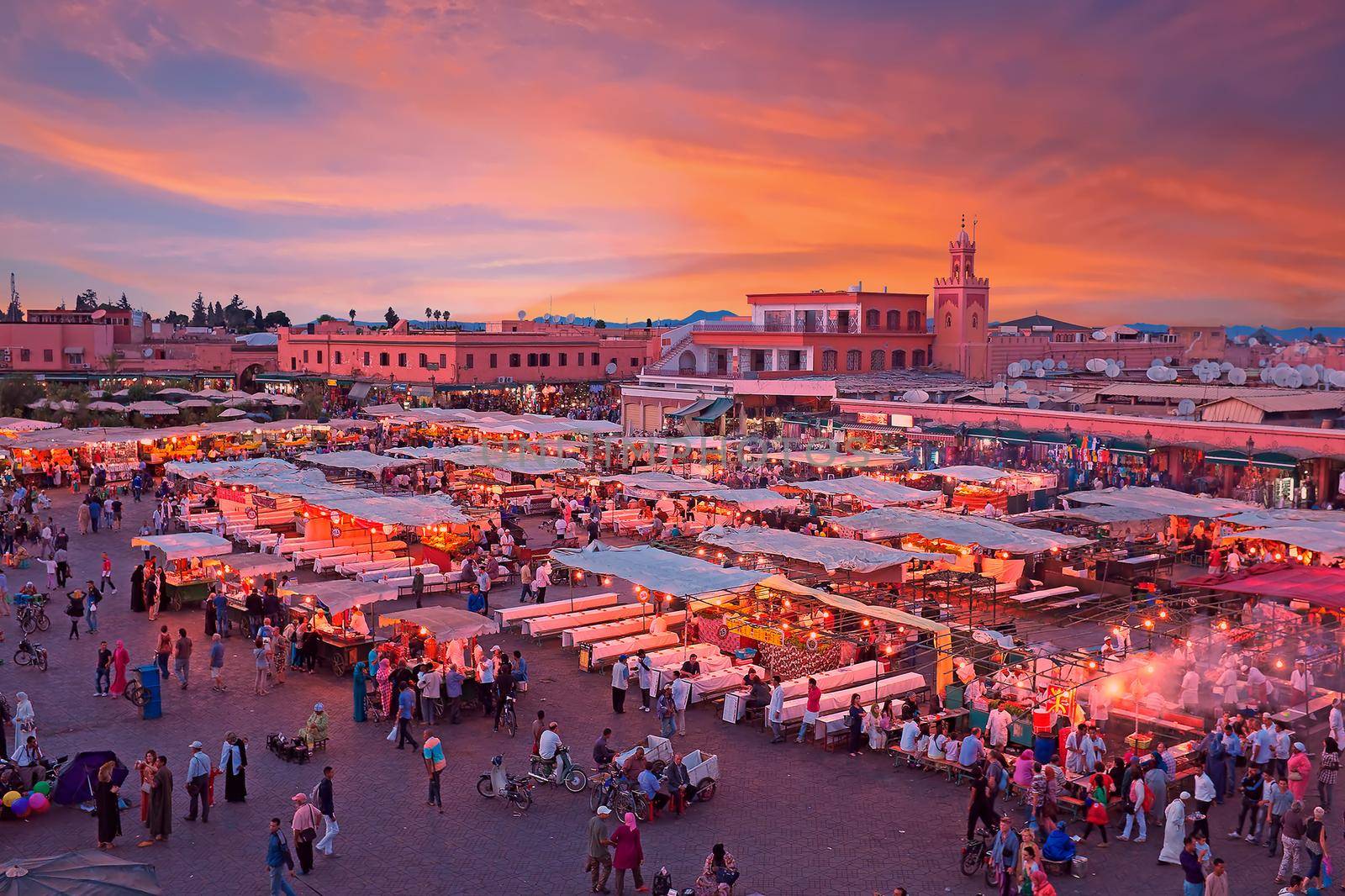 MARRAKESH, MOROCCO - October 22, 2013: Evening on Djemaa El Fna Square with Koutoubia Mosque, Marrakech, Morocco by devy