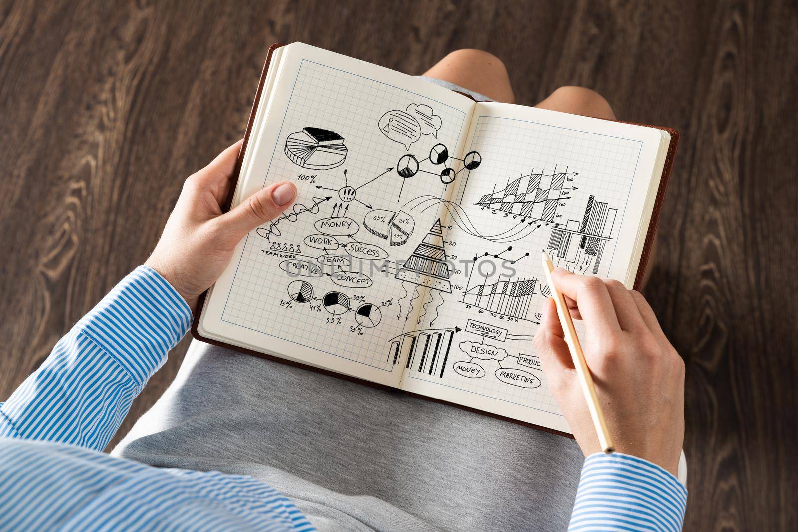 close-up, the business lady with notebook. Concept of business planning