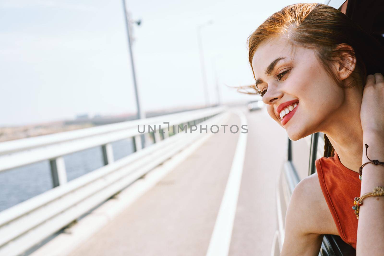 cheerful woman car ride road travel adventure by Vichizh