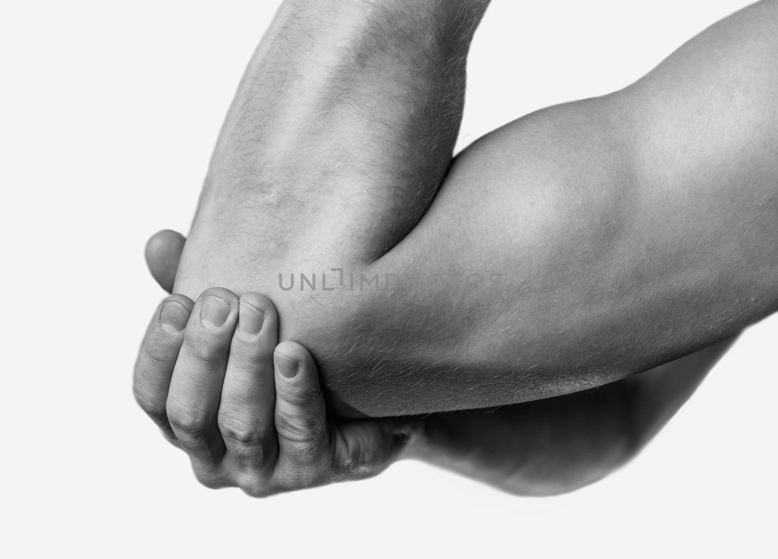 The man is touching the elbow due to acute pain. Monochrome image, isolated on a white background