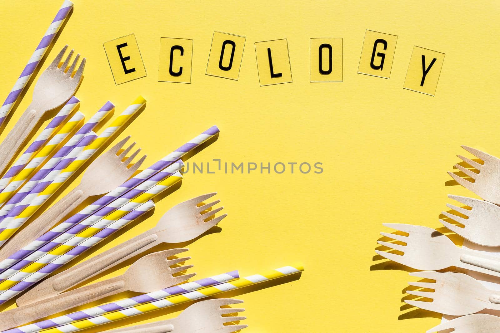 Wooden disposable forks, knifes on red background, recycling and eco friendly concept. Zero waste, plastic free items, stop plastic. Top view. Place for text