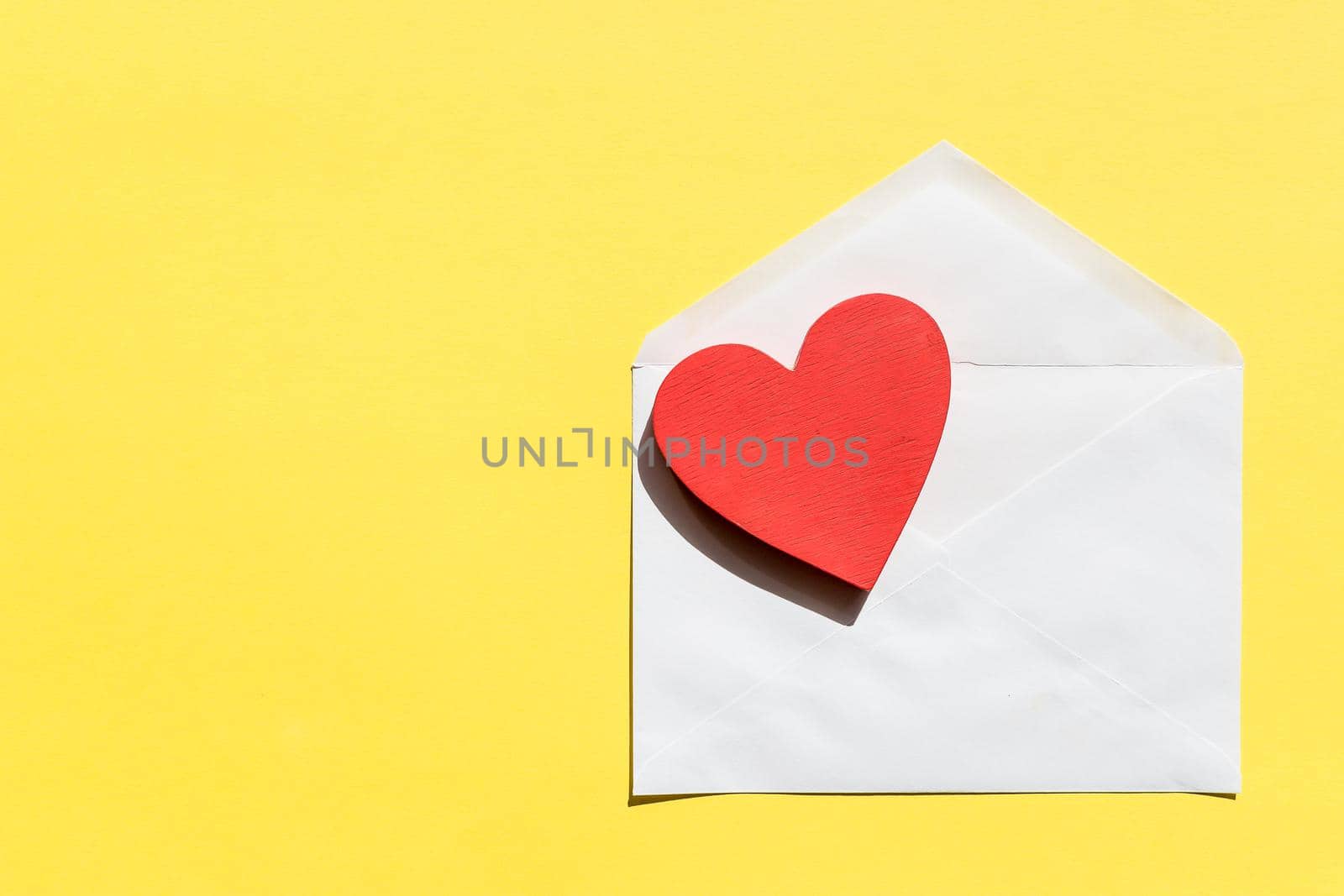 Opened envelope and many felt hearts.Copy space