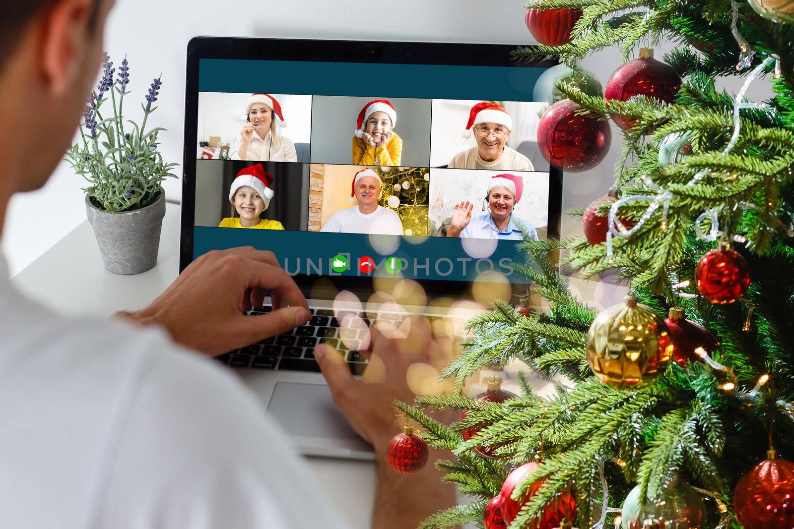 Virtual Christmas meeting team teleworking. Family video call remote conference Computer webcam screen view. Diverse portrait headshots meet working from their home offices. Happy hour party online