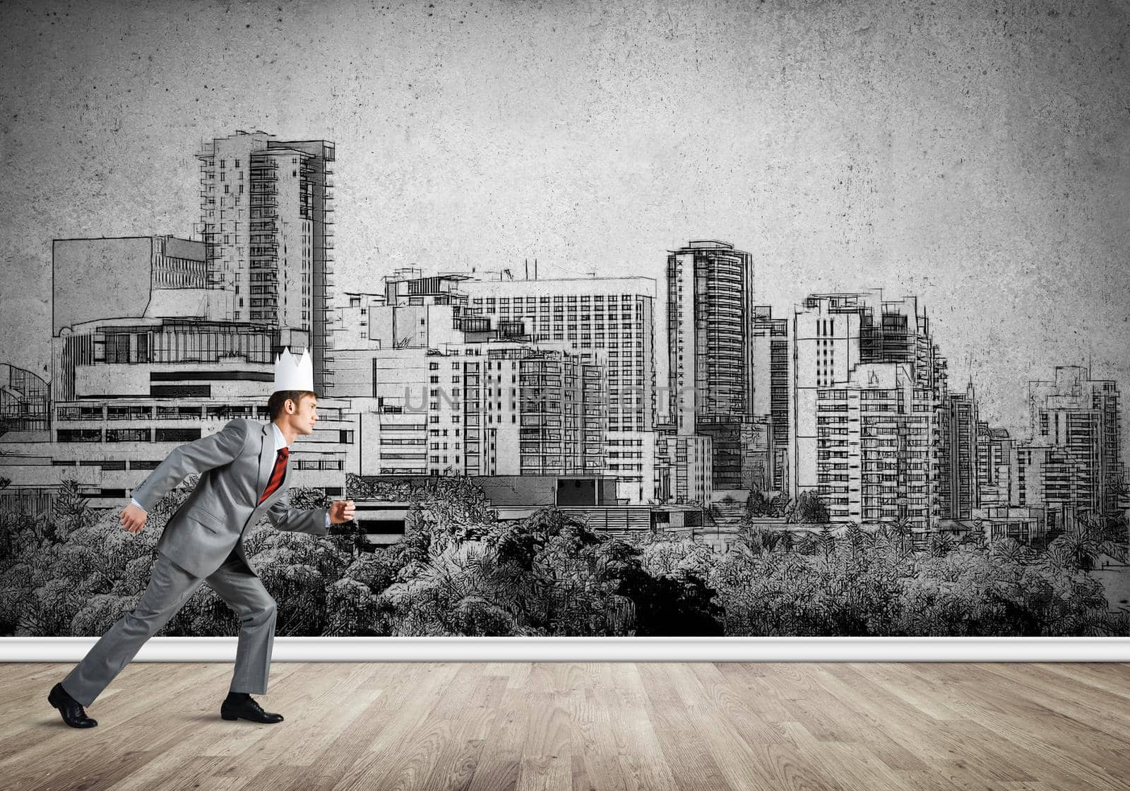 Young handsome businessman wearing white paper crown running in a hurry