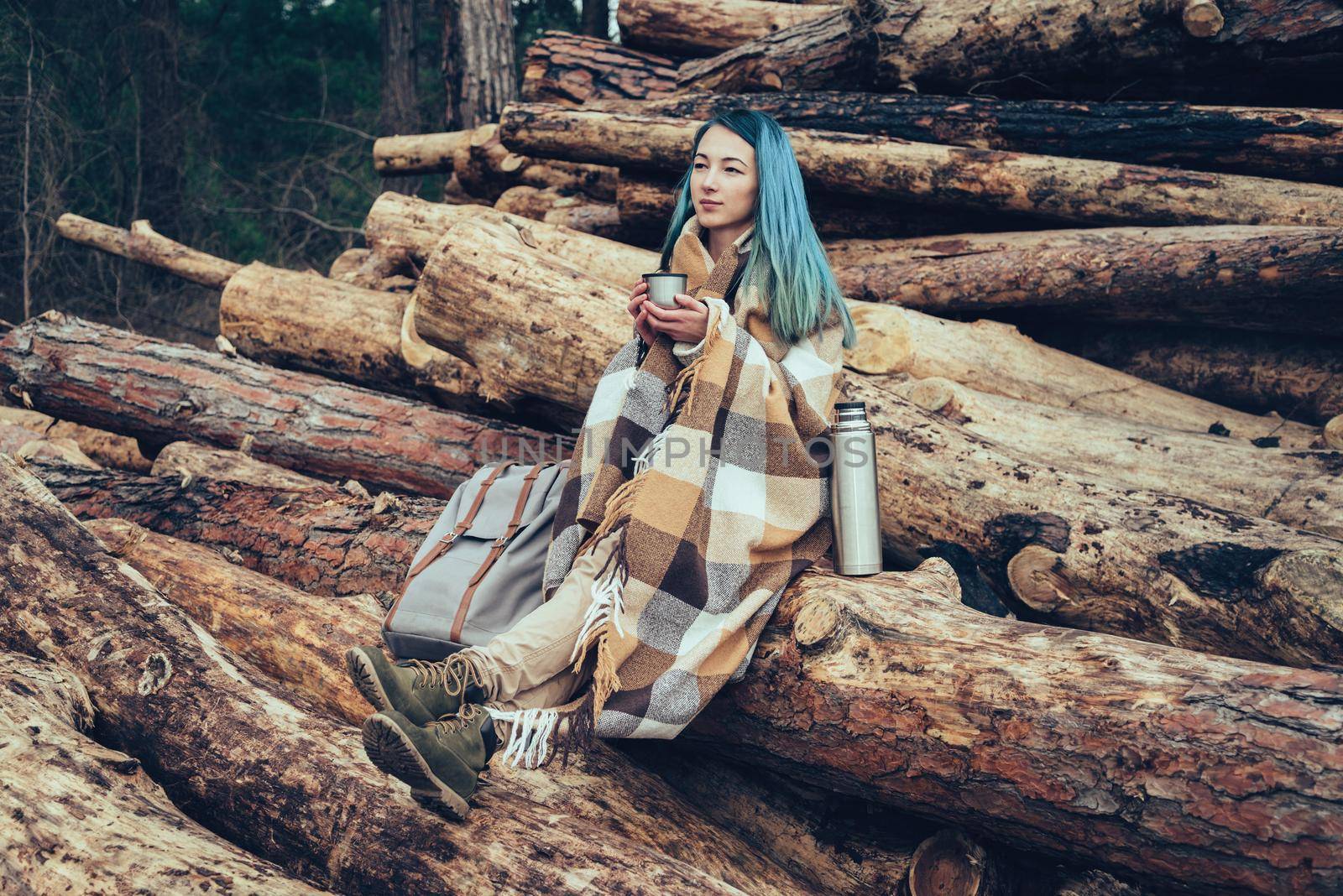 Woman resting with cup of tea by alexAleksei