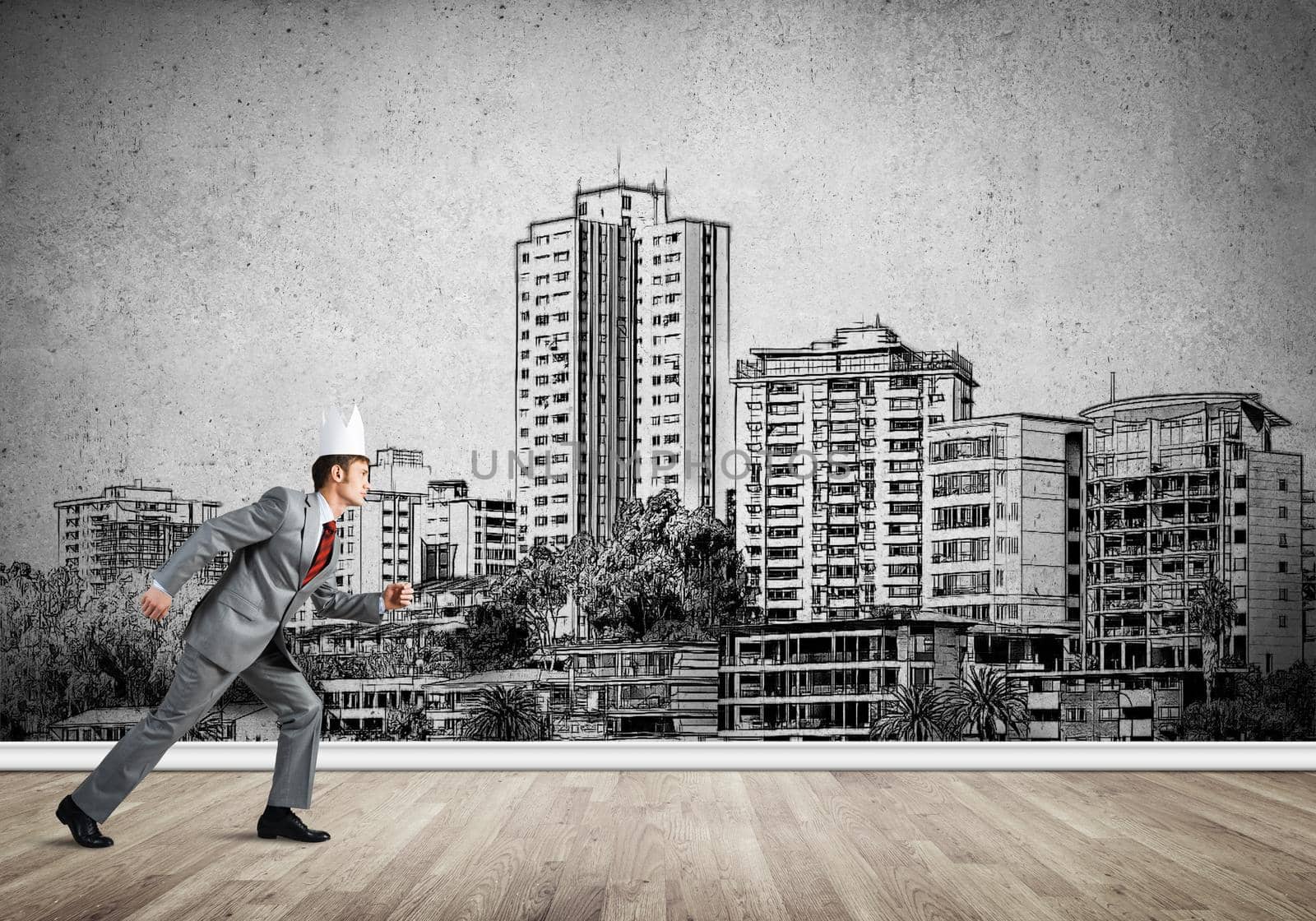 Young handsome businessman wearing white paper crown running in a hurry