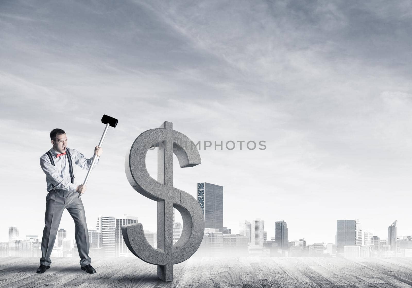 Young furious businessman going to crash with hammer stone dollar symbol