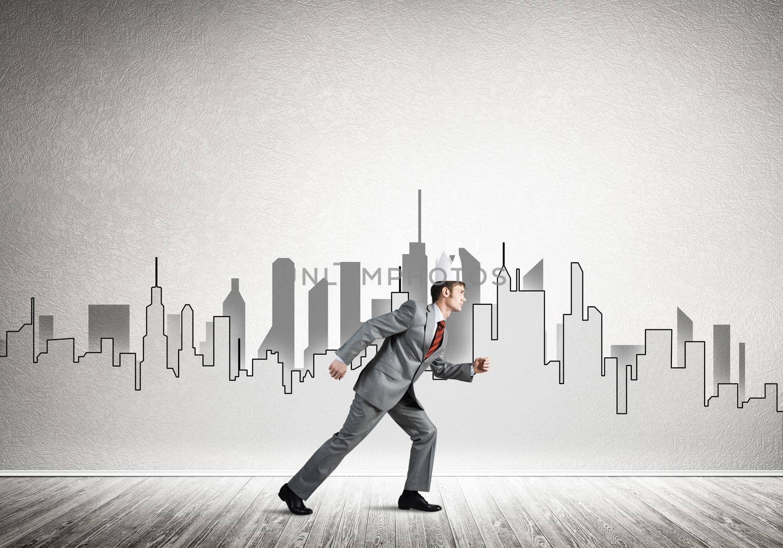 Young handsome businessman wearing white paper crown running in a hurry
