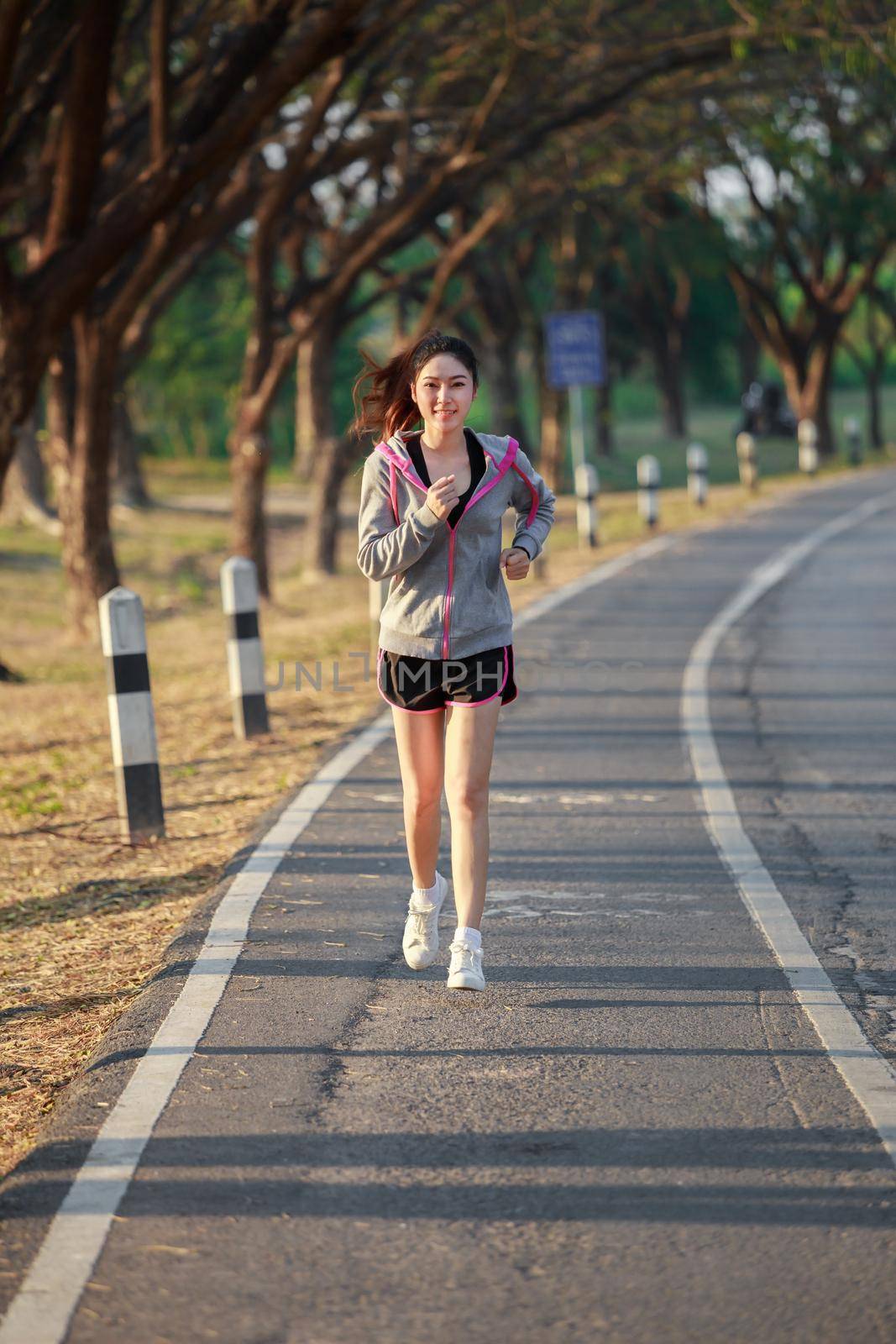 fitness woman running in park by geargodz
