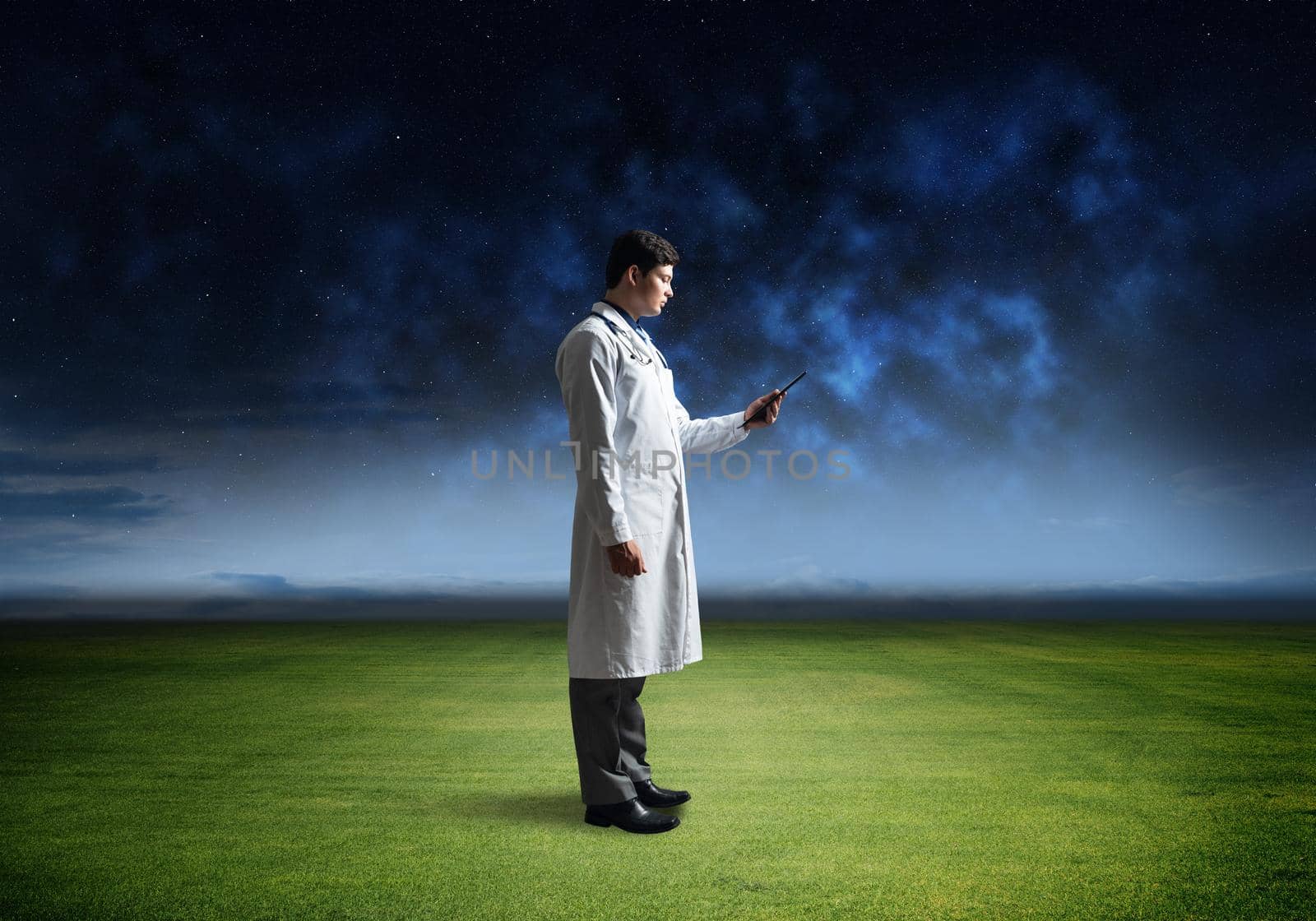 portrait of a doctor, holding a tablet
