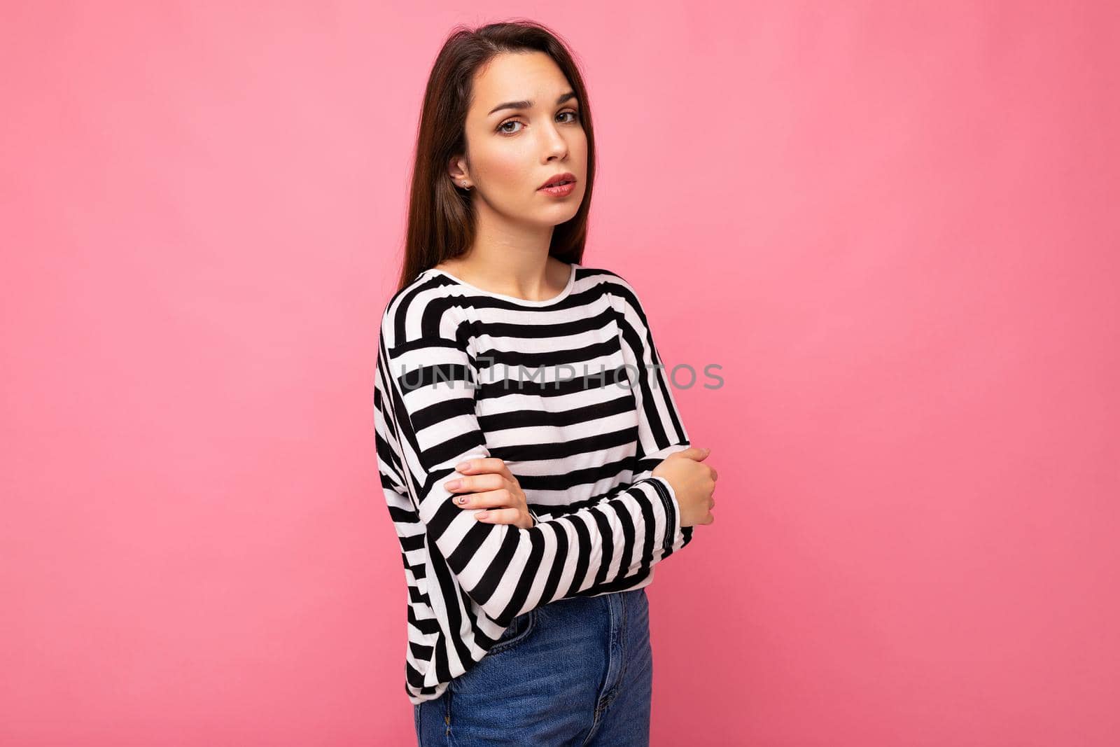 Photo shot of nice attractive pretty young sad upset sorrowful brunette woman wearing casual striped longsleeve isolated over colorful background with copy space.