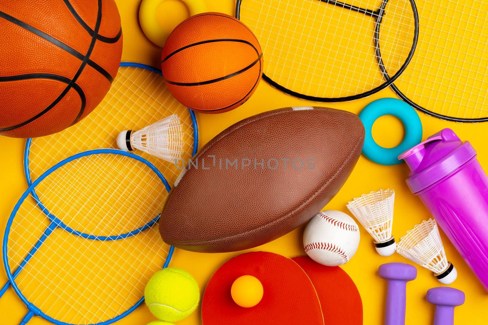 Composition of various sport equipment for fitness and games. Close up.