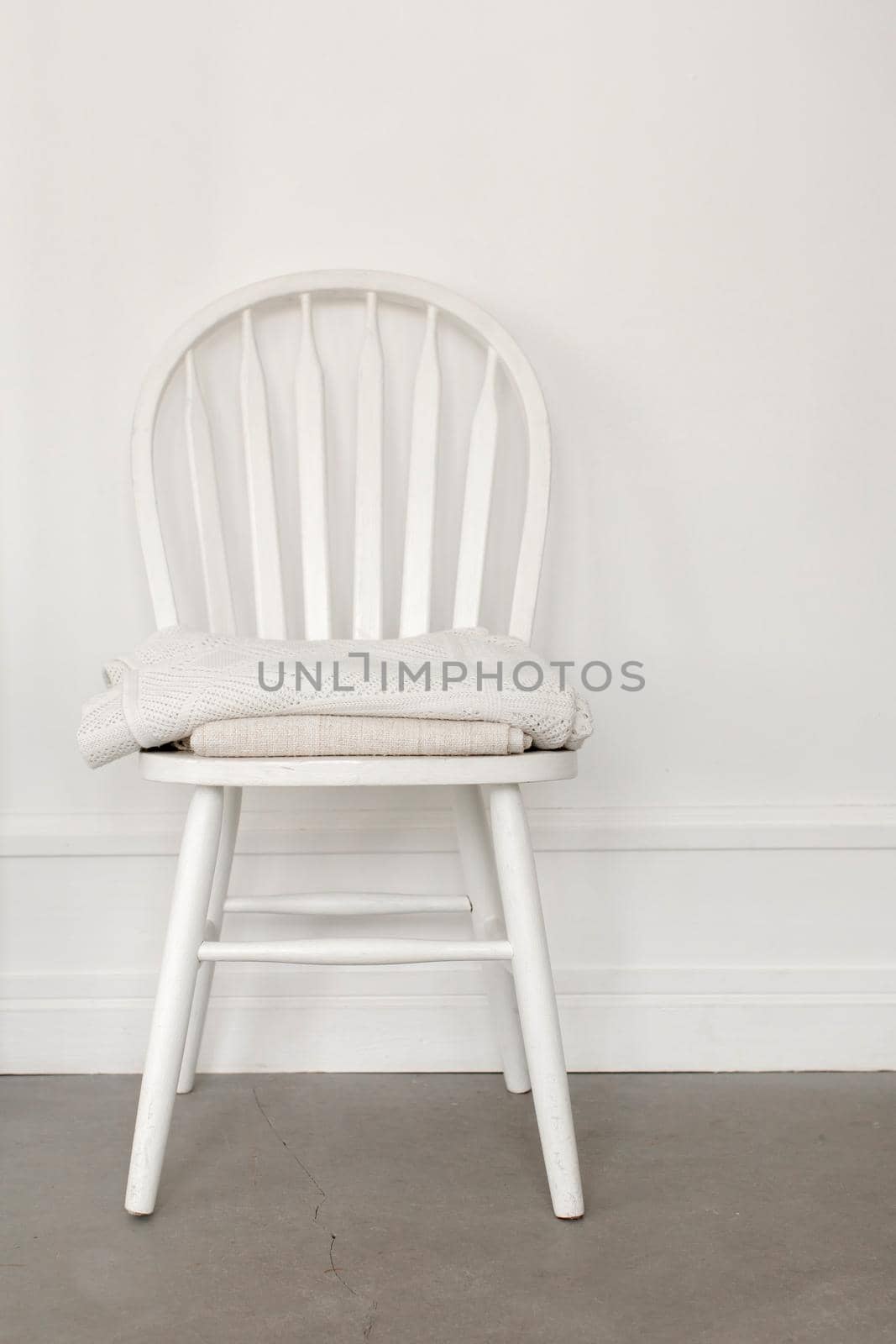 White chair on wall background by Demkat