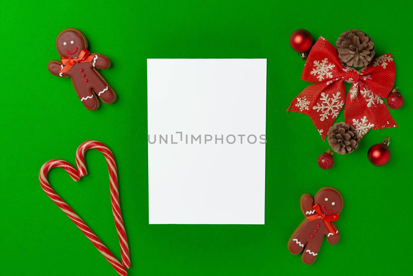 Blank Christmas greeting card with festive decorations, top view