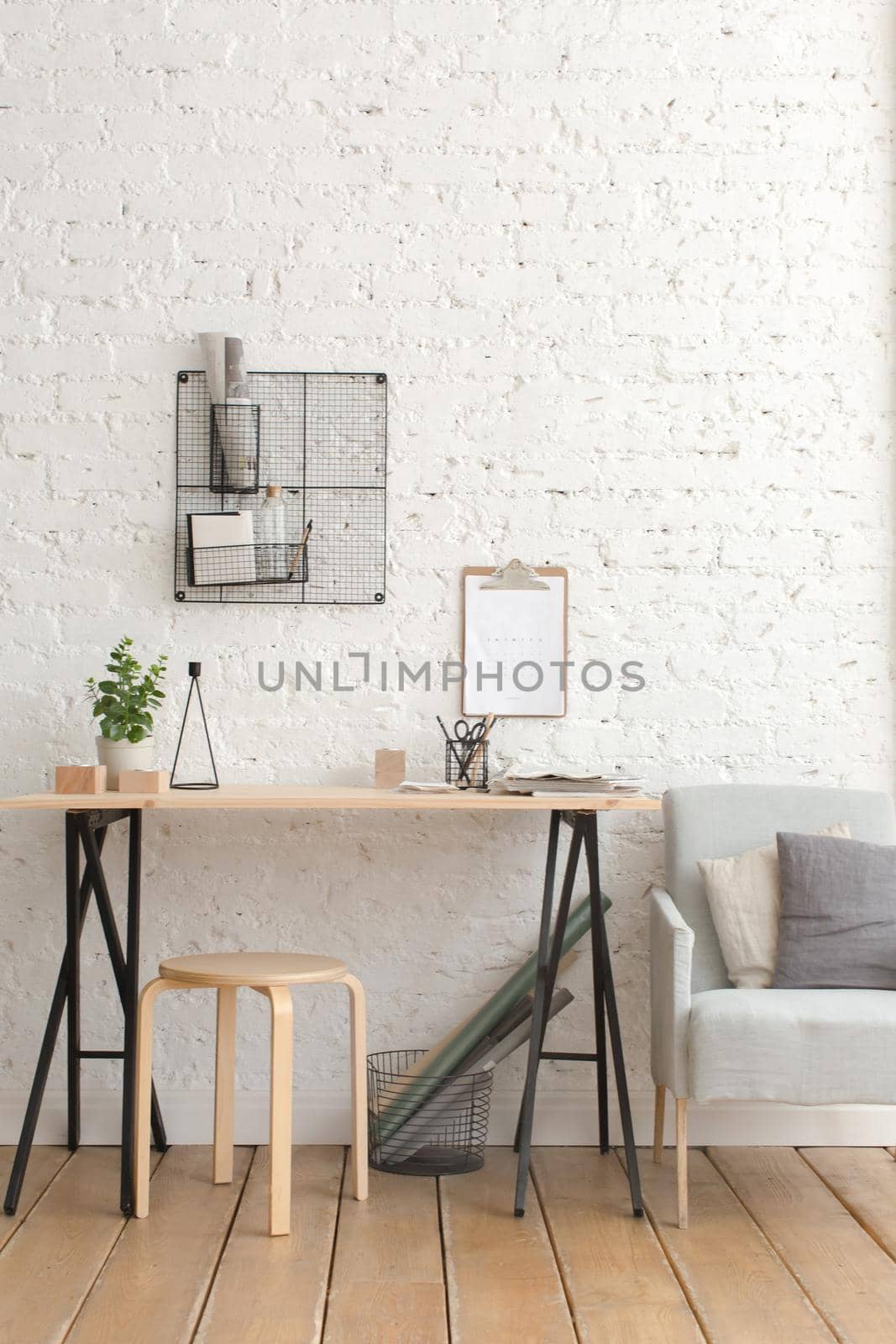 Desk with stationery in the white interior Loft by Demkat