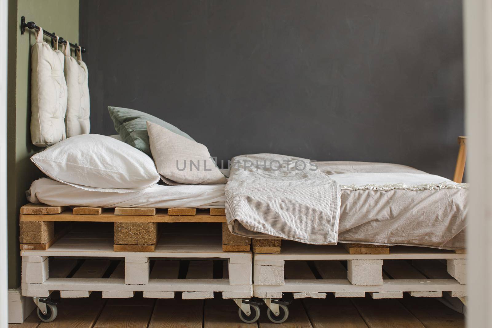 Industrial style bedroom with recycled pallet bed frame designs