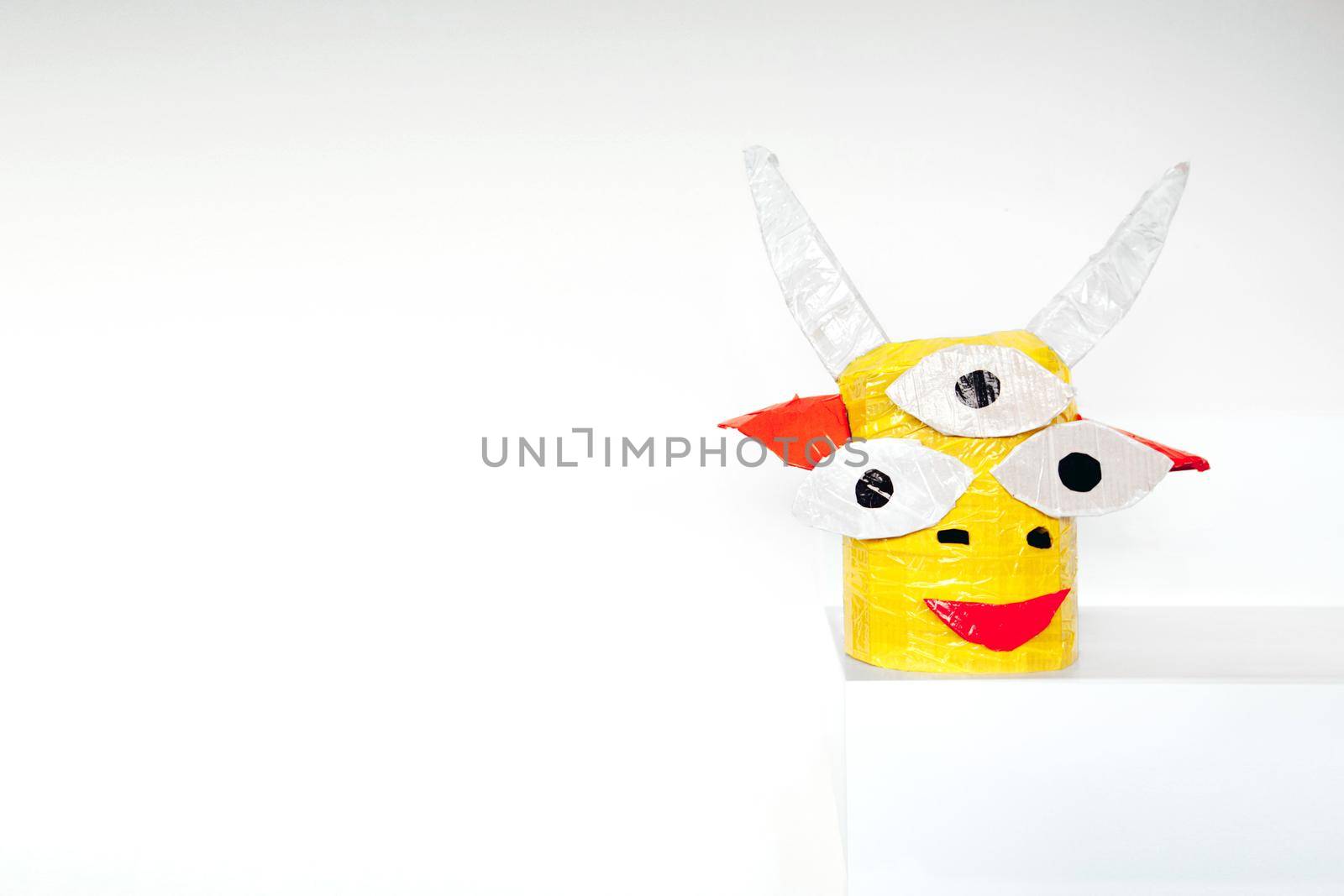 Paper head of a mythical creature isolated by Demkat