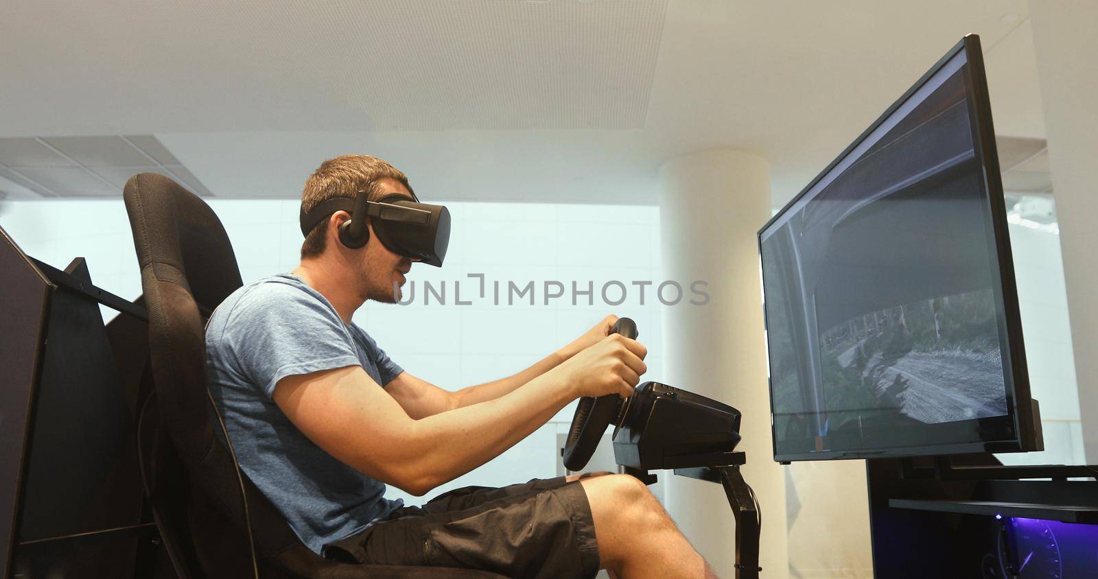 Man racing in VR headset by Demkat