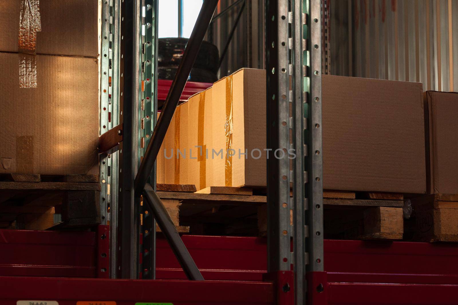 Modern warehouse shelves with pile of cardboard boxes. Close up.