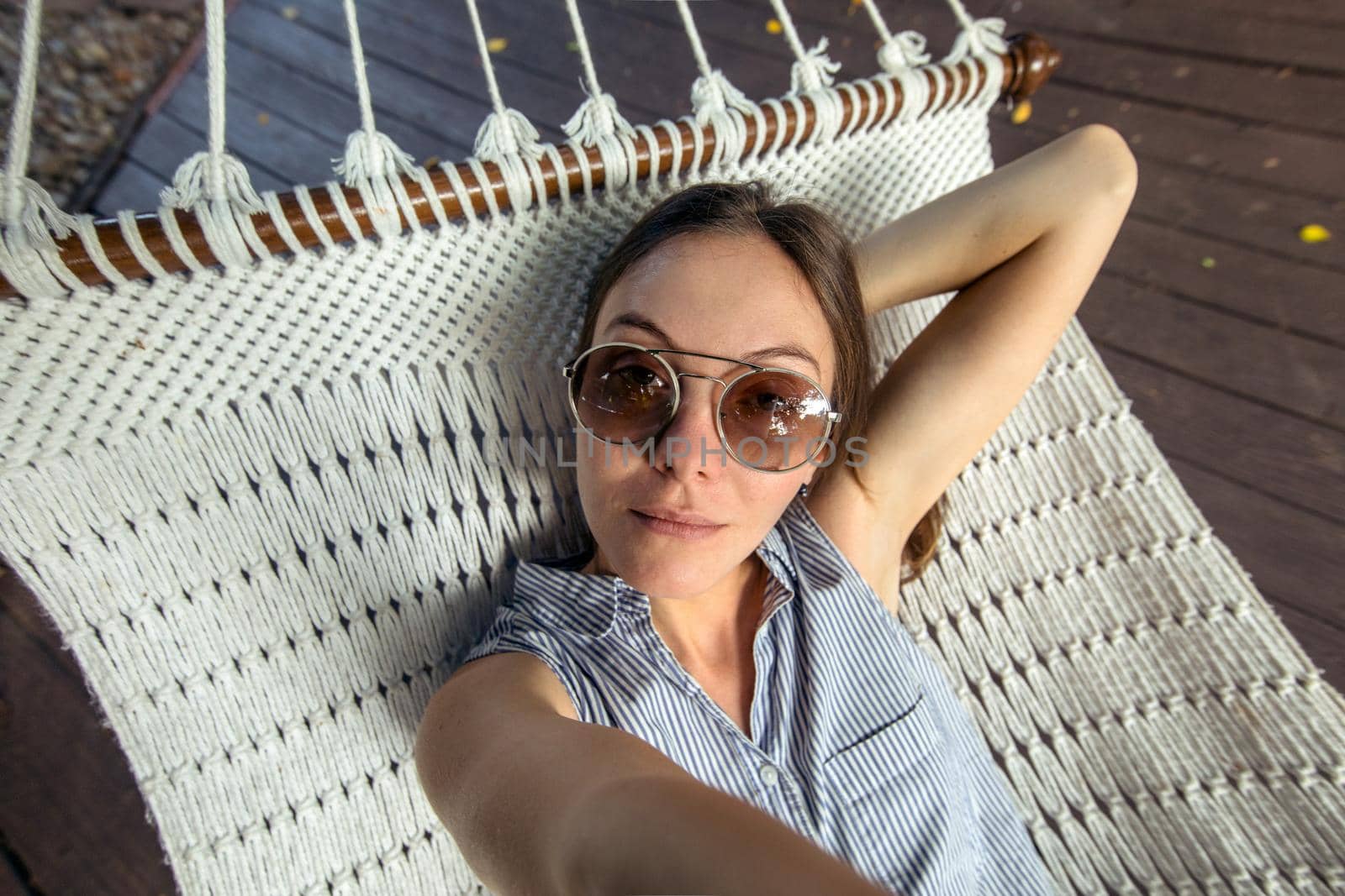 Woman laying in hammock pov Vacation selfie by Demkat