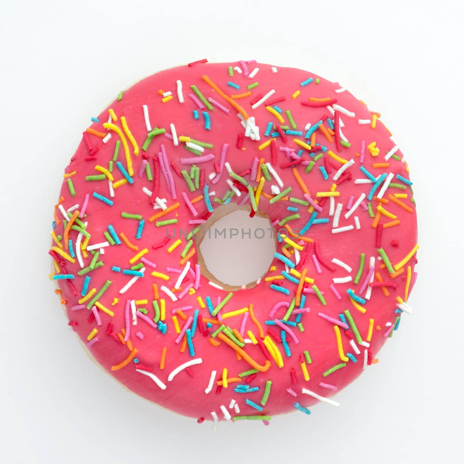 Donut with colorful sprinkles isolated by Demkat