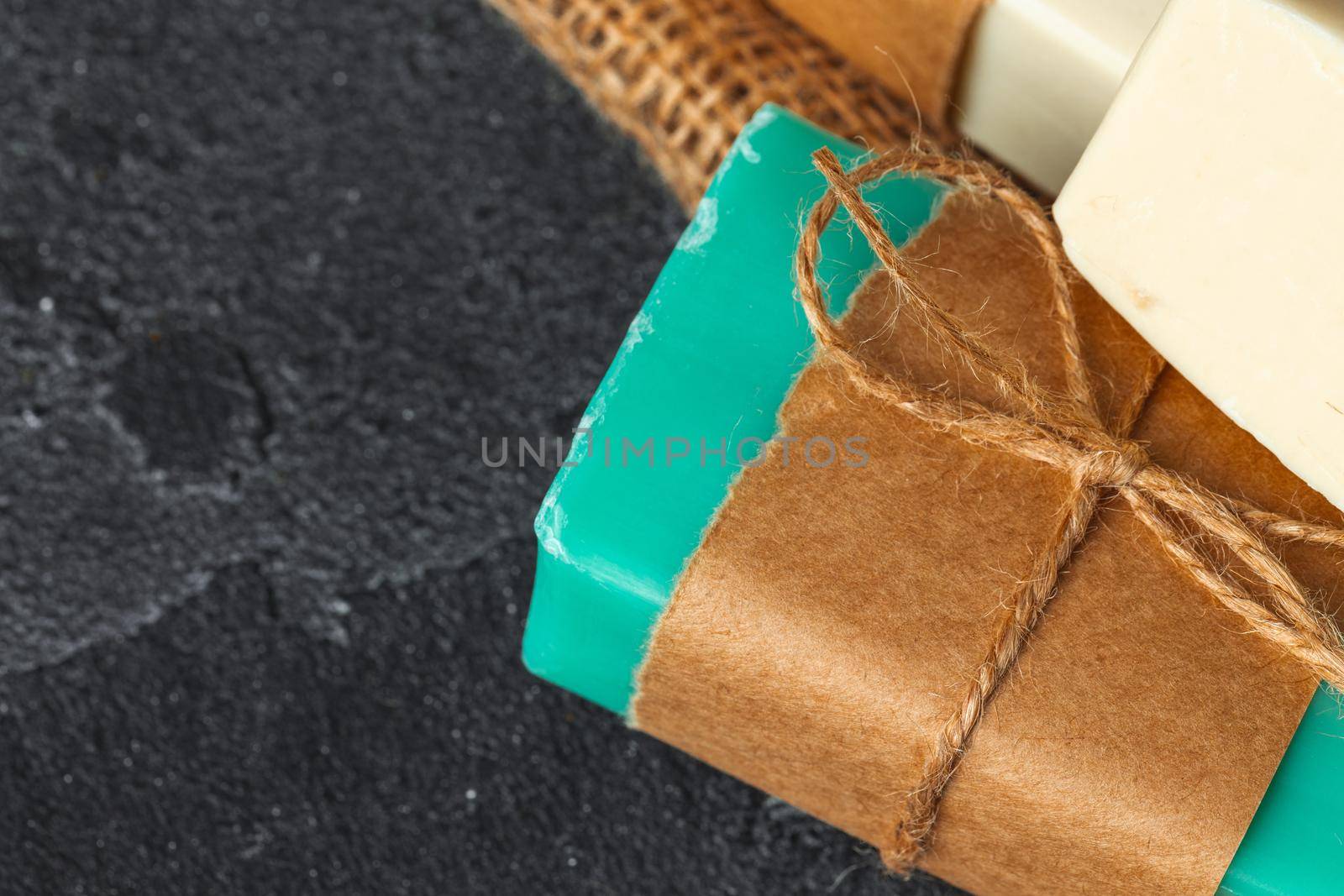 Soap bars with natural ingredients on the table, close up.