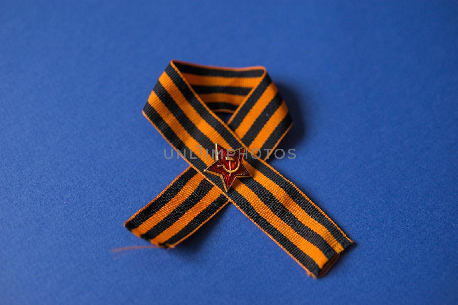 Tver Russia-may 9, 2020: 75 years of Victory in the great Patriotic war. St. George ribbon for 75 years of victory on a blue background. Happy Victory Day Space for text.