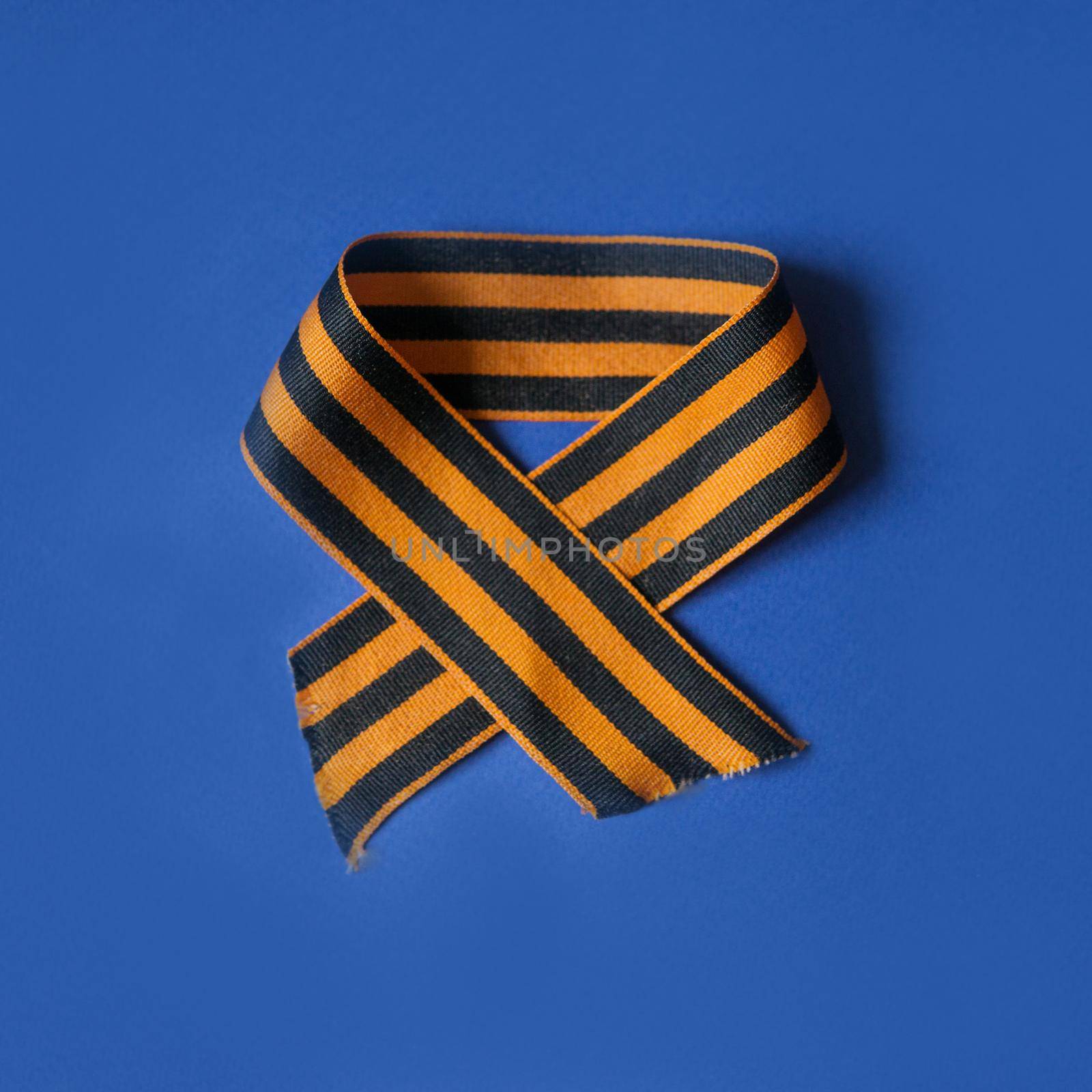 Tver Russia-may 9, 2020: 75 years of Victory in the great Patriotic war. St. George ribbon for 75 years of victory on a blue background. Happy Victory Day
