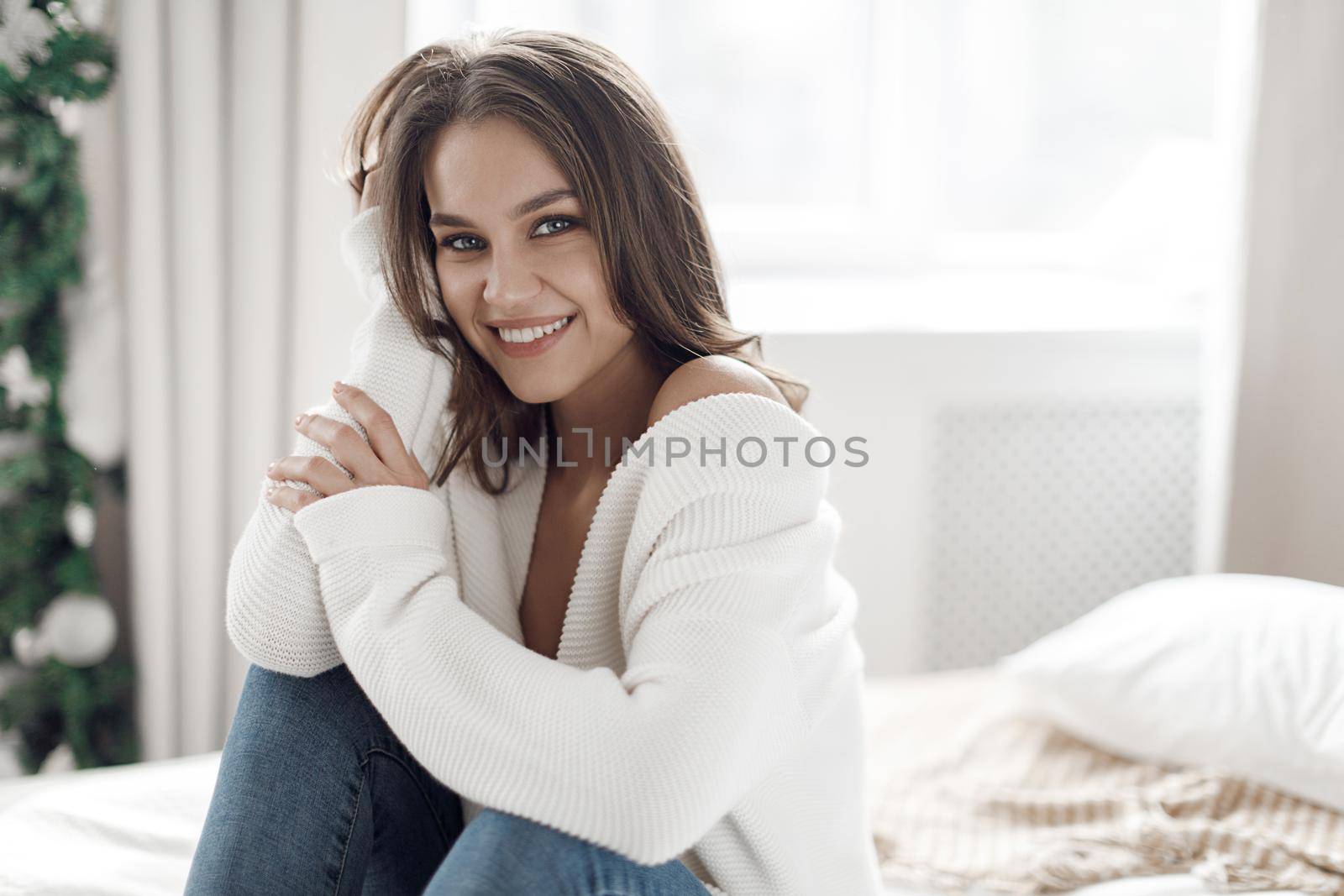 Portrait of a young happy woman at home. High quality photo