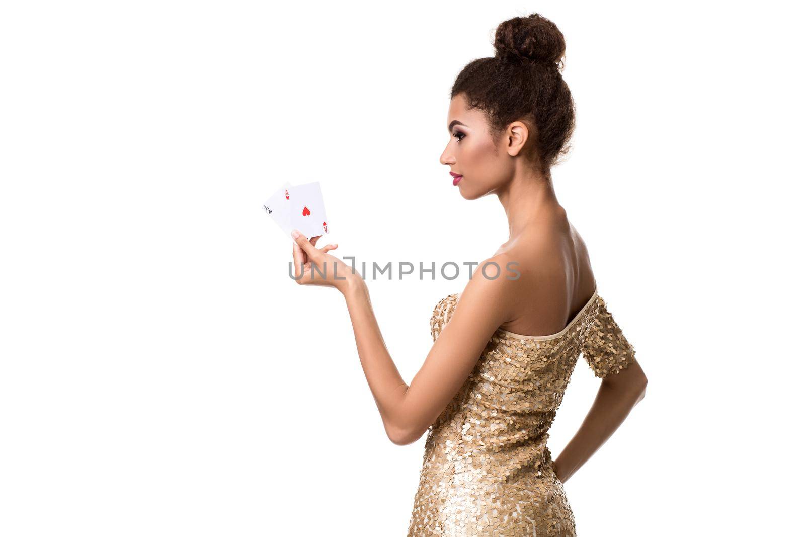 Pretty african girl shows two aces in casino poker and win Young woman in studio on white background