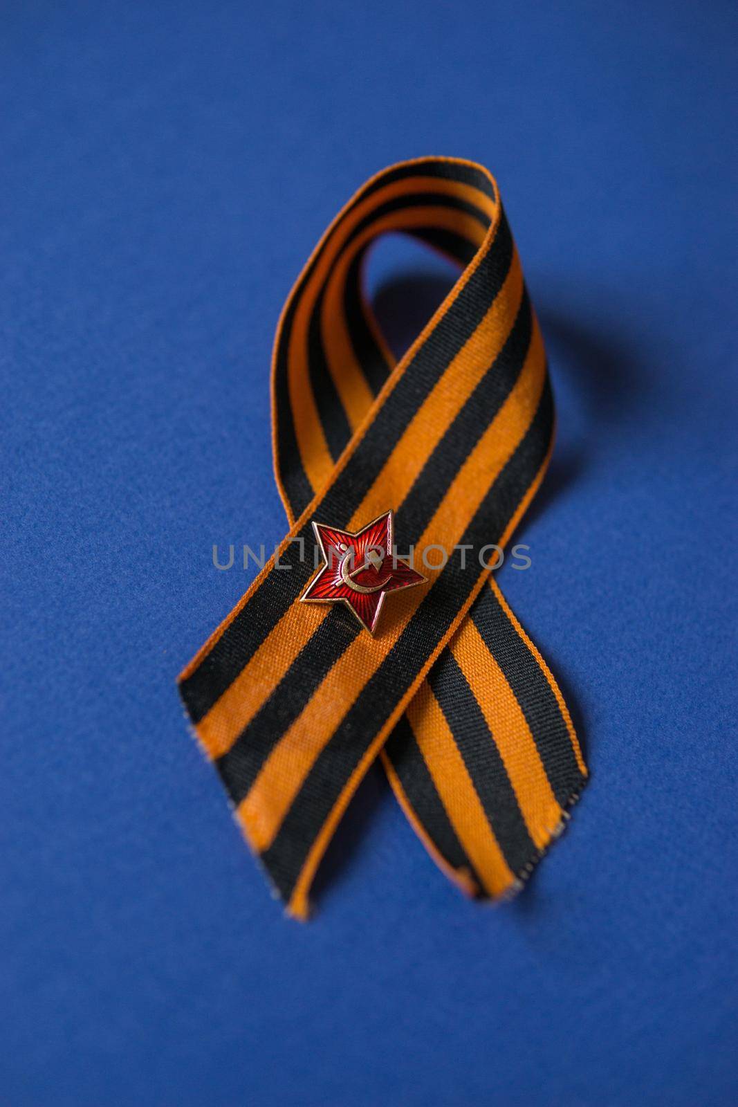 Tver Russia-may 9, 2020: 75 years of Victory in the great Patriotic war. St. George ribbon for 75 years of victory on a blue background. Happy Victory Day Space for text.