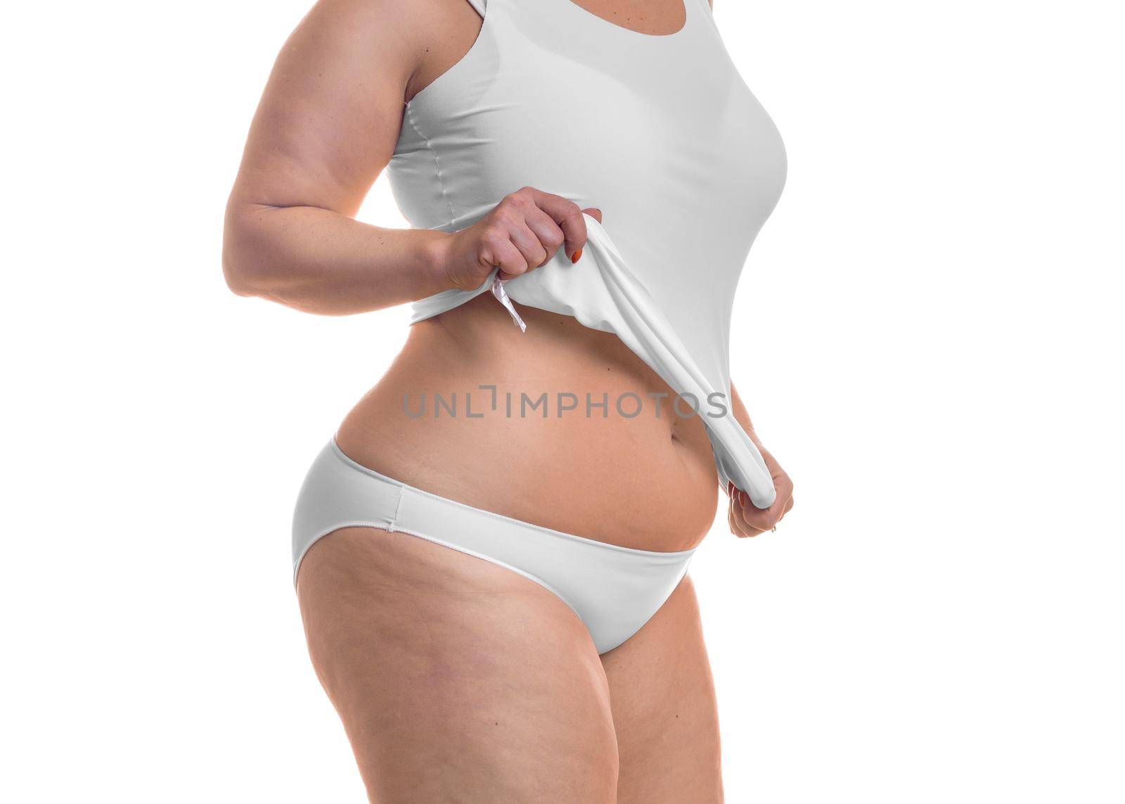 Body of a fat woman isolated over white background. Slimming concept.
