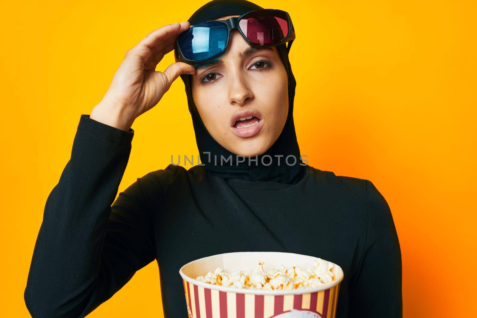 Muslim watching movies 3D glasses fun studio lifestyle. High quality photo