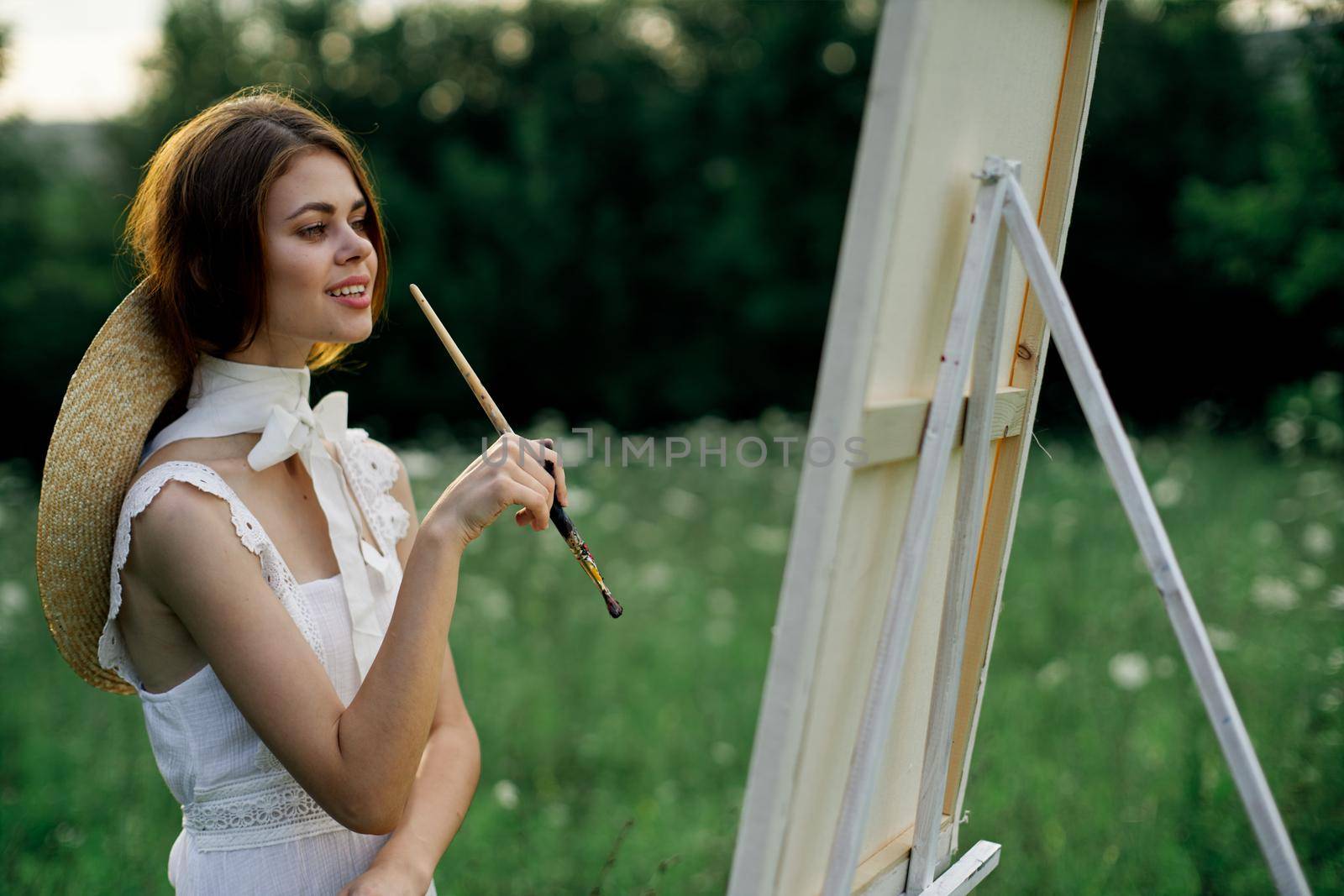 woman artist outdoors painting nature hobby art by Vichizh