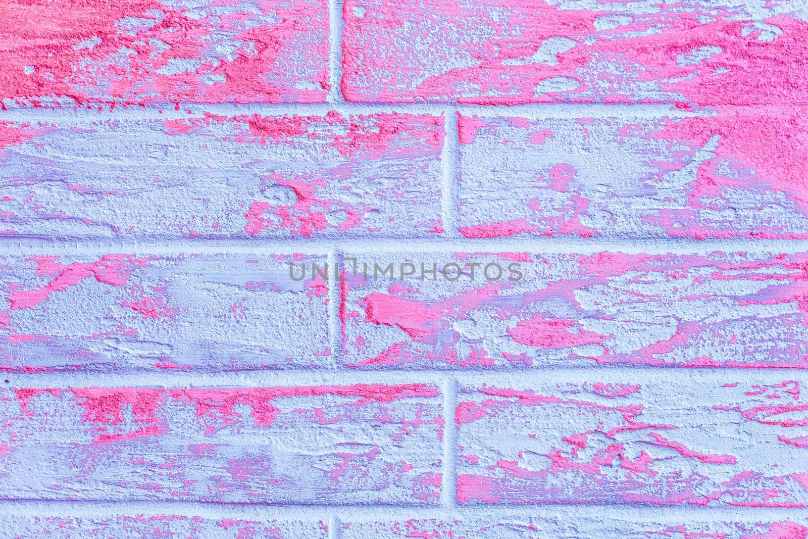 Pink or purple and light blue abstract paint pattern surface brick wall texture background.