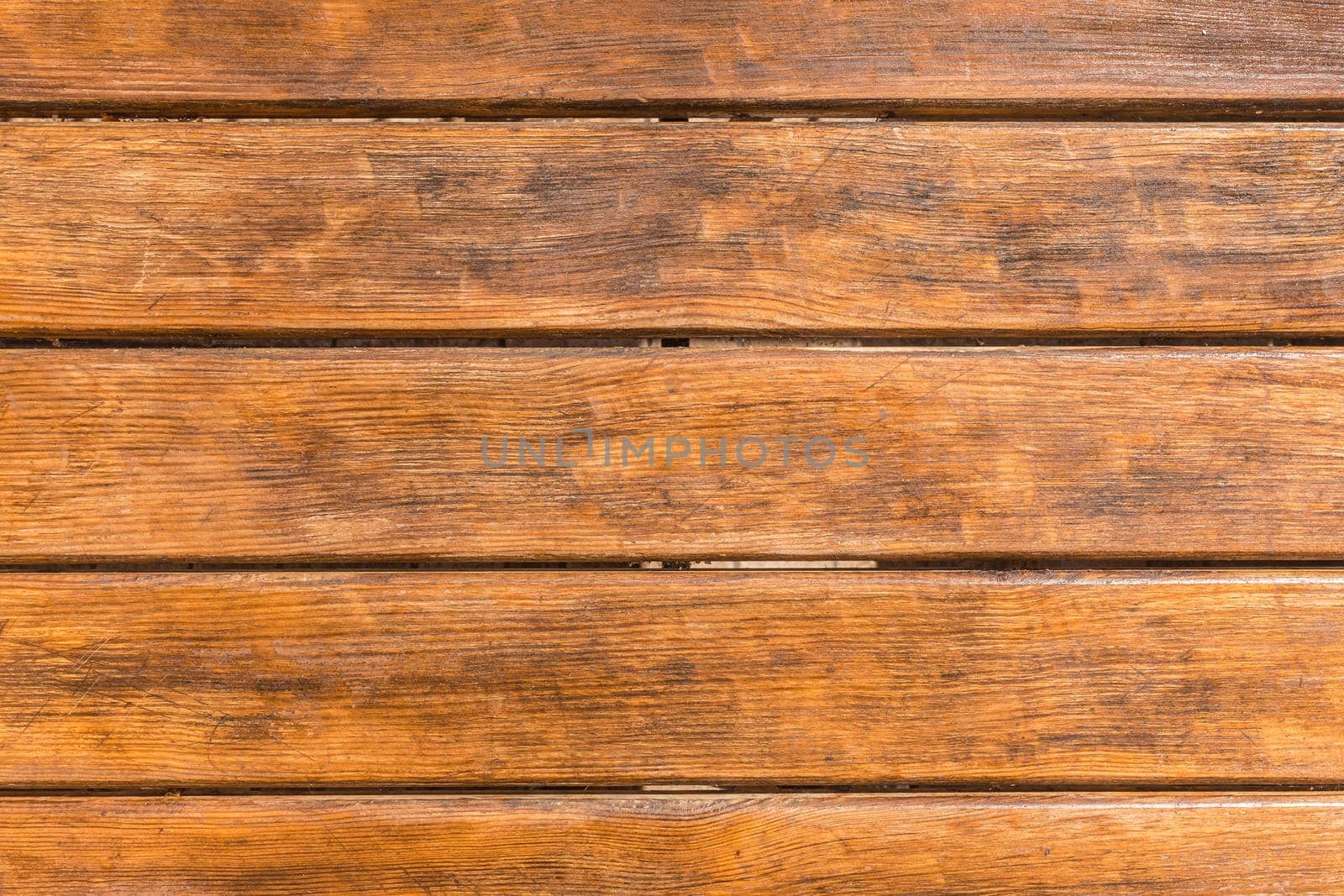 Horizontal old brown planks table texture background, top view.