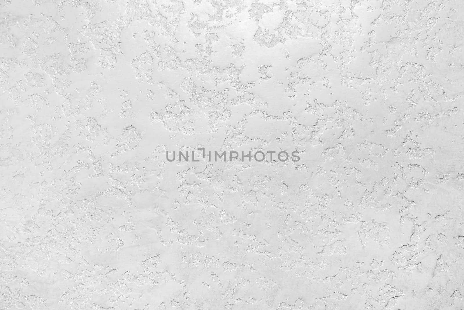 Modern white plaster wall with abstract pattern surface texture background.