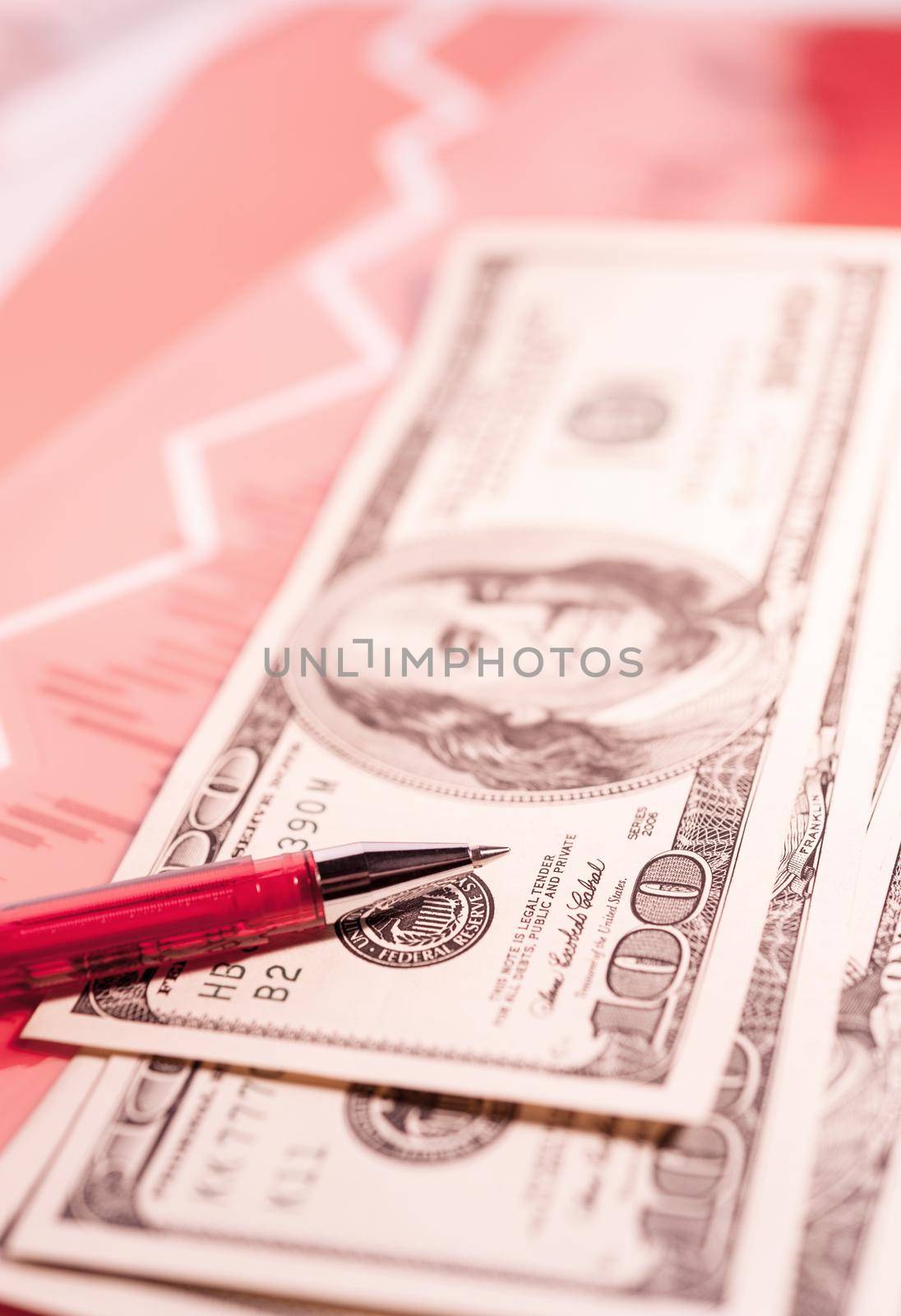 Finance background with money, stock market chart, graph and pen. Living coral toned. by bashta