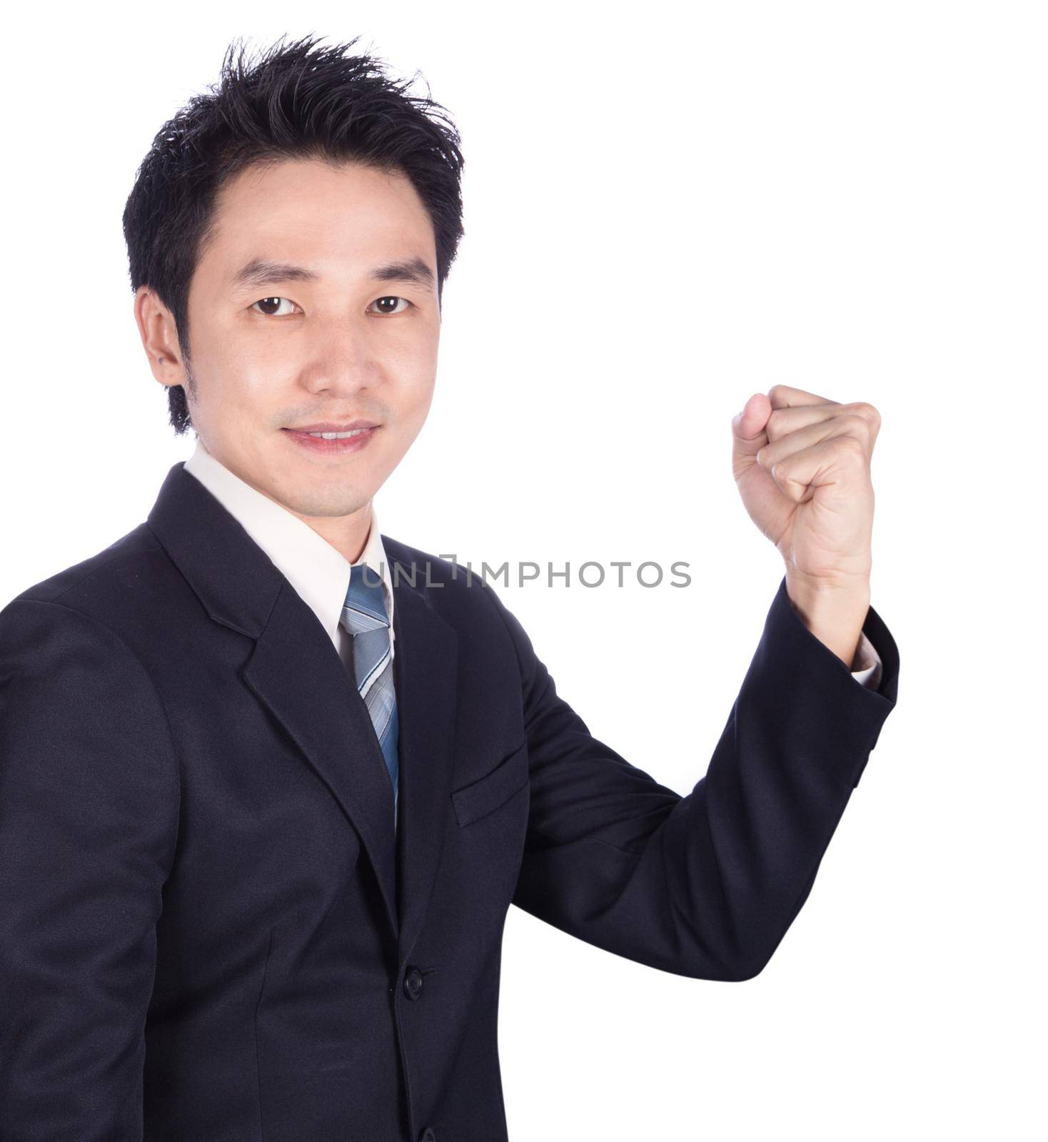 Successful business man with arm raised isolated on white  by geargodz