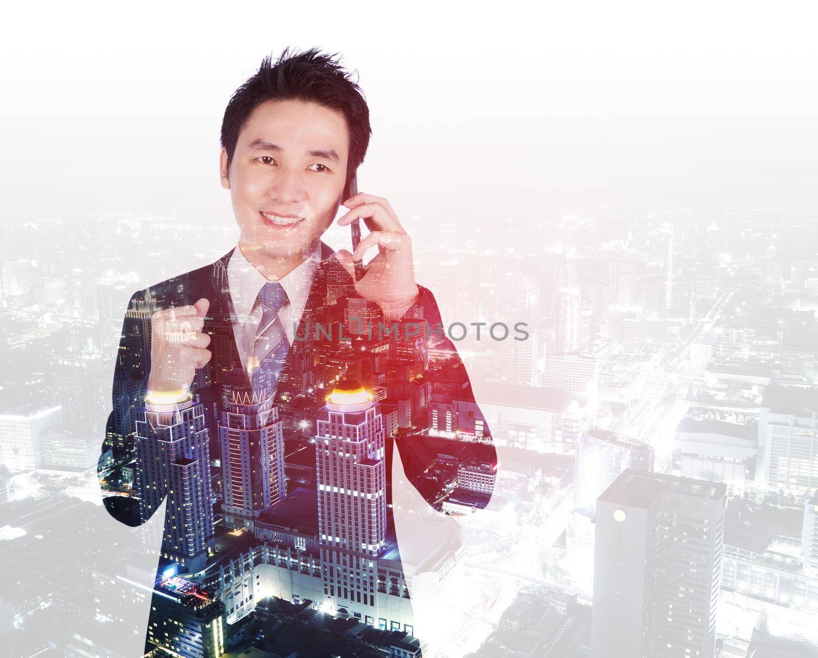 double exposure of happy businessman talking on smartphone with city background by geargodz