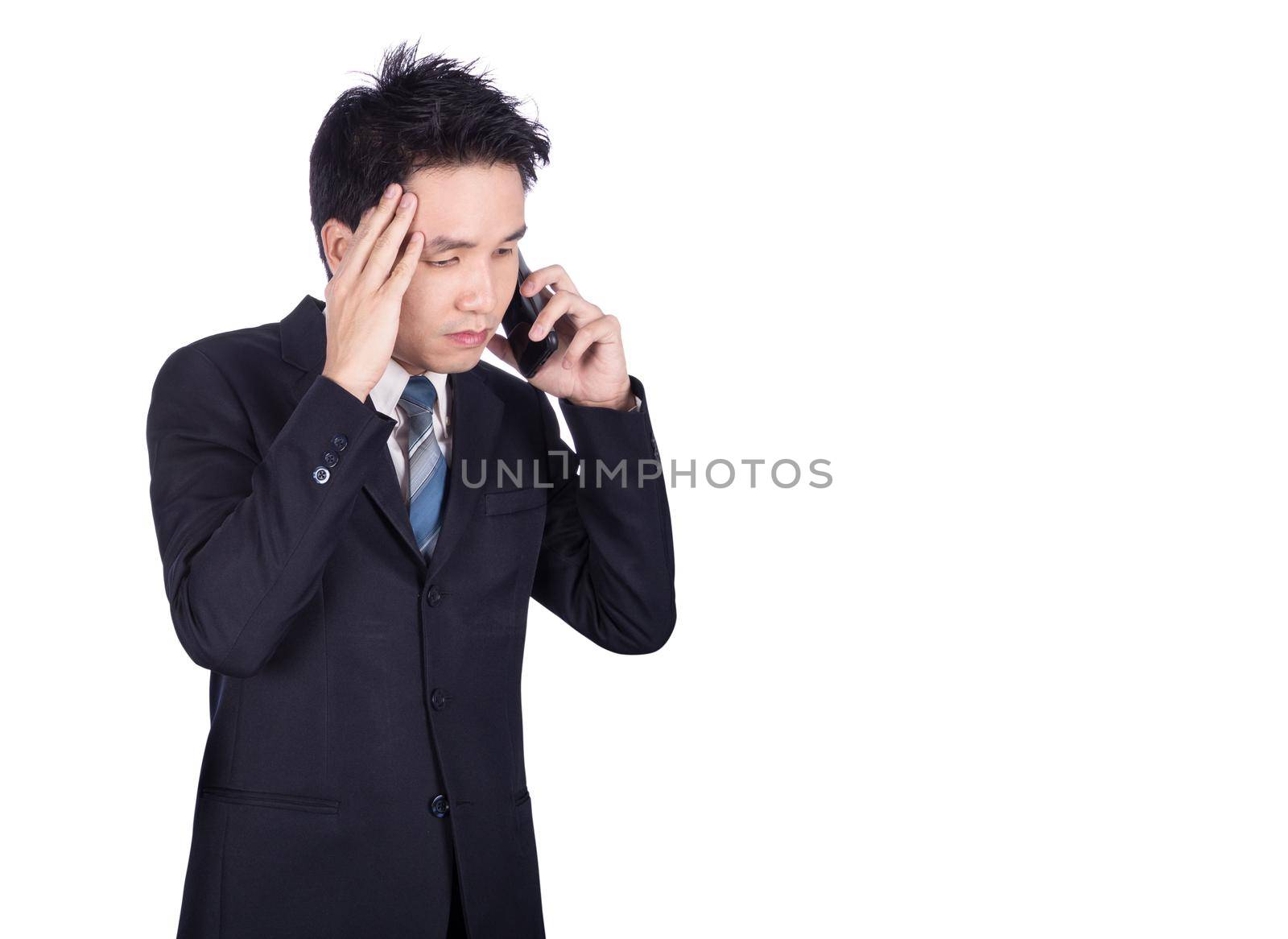 worried businessman talking on smartphone isolated on white background