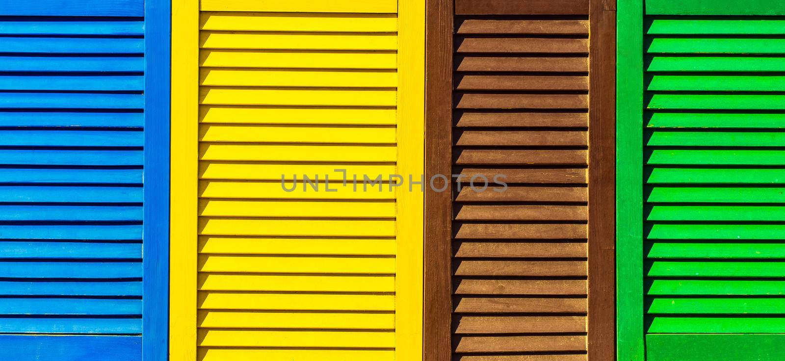 Part of modern interior with colorful patterned texture of wooden shutters, casements or blinds background.