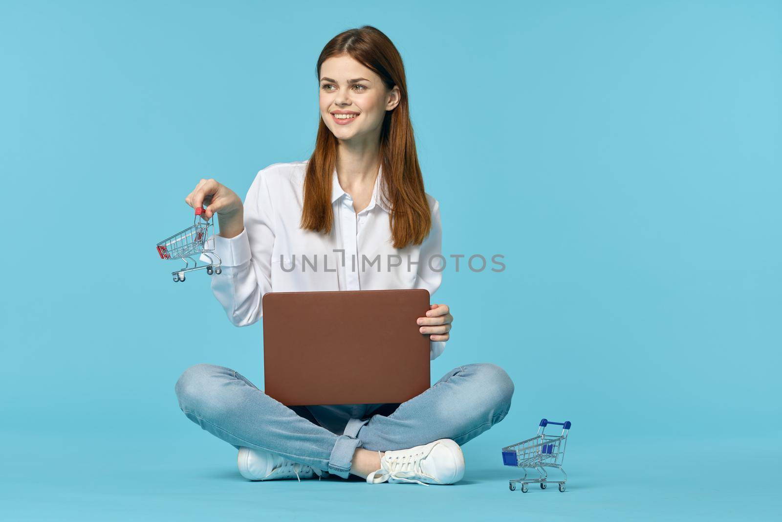 woman with laptop learning internet online education blue background by Vichizh