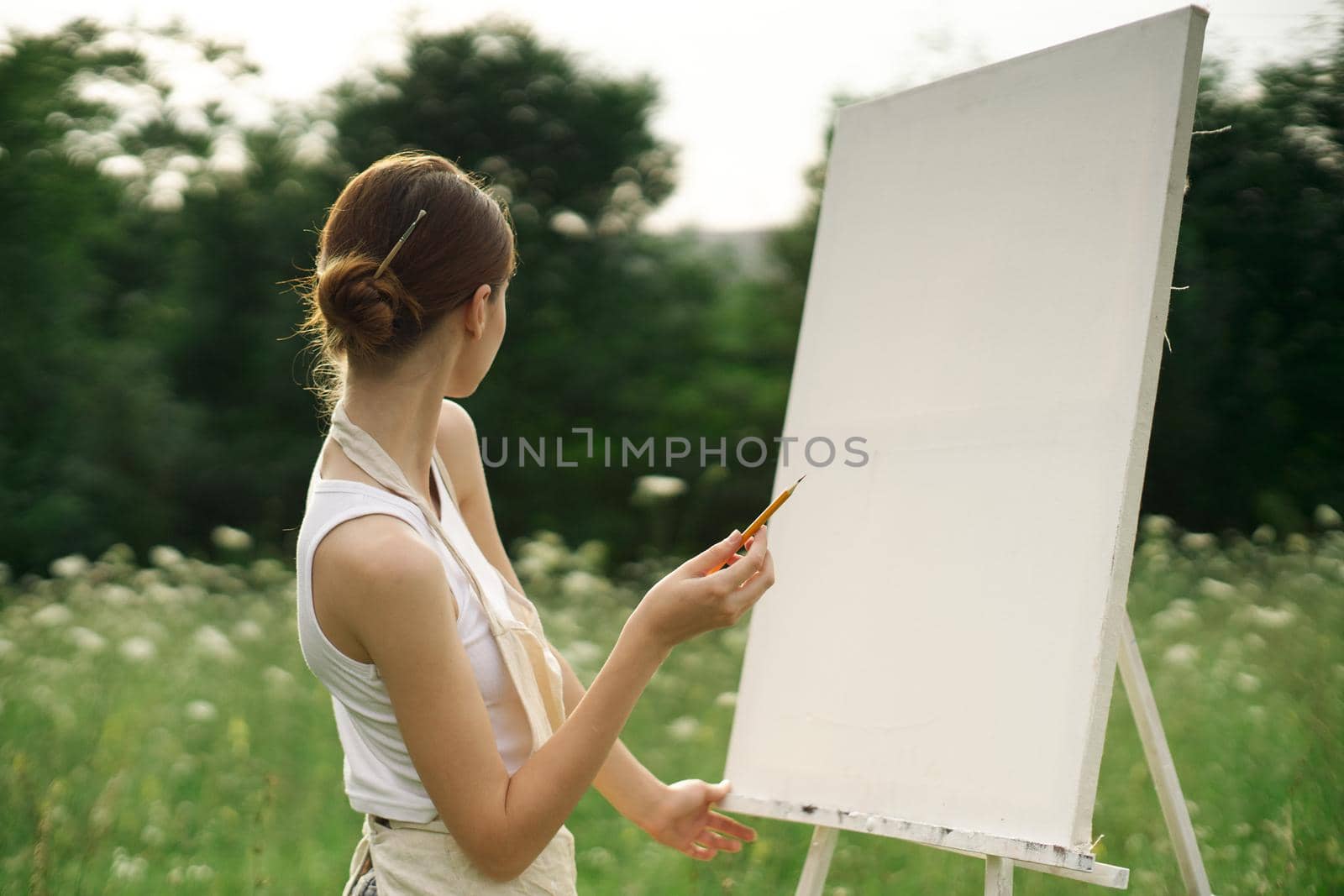 woman artist nature drawing landscape art hobby. High quality photo