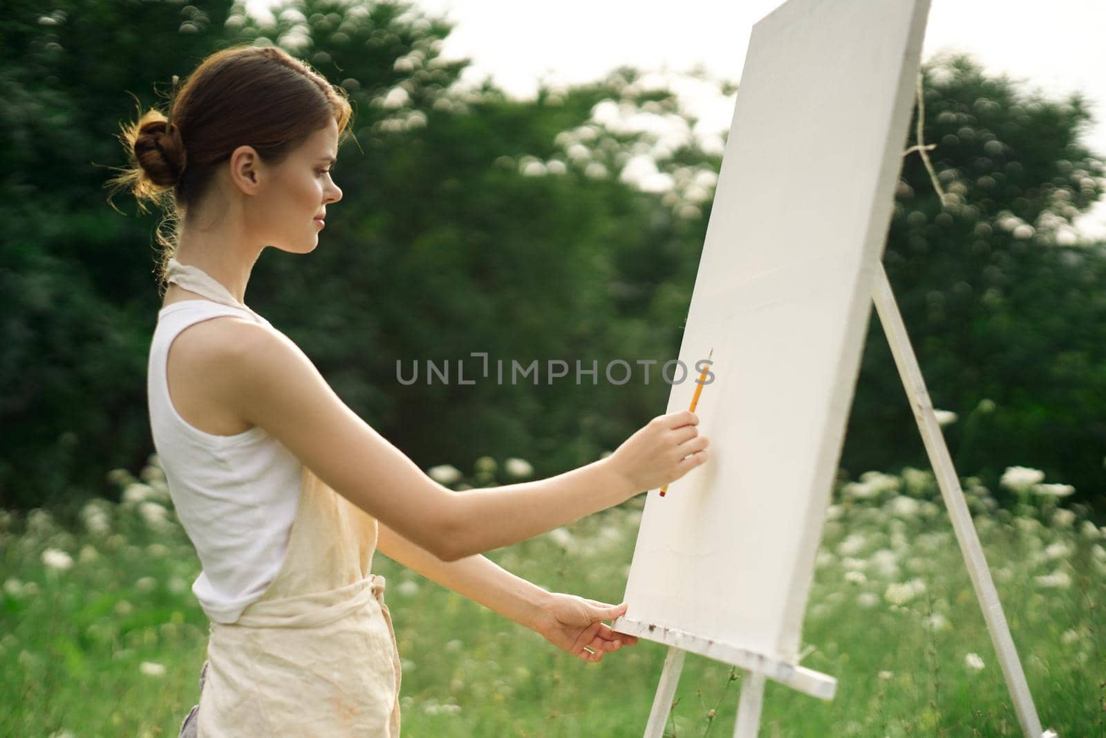 woman artist nature drawing landscape art hobby. High quality photo