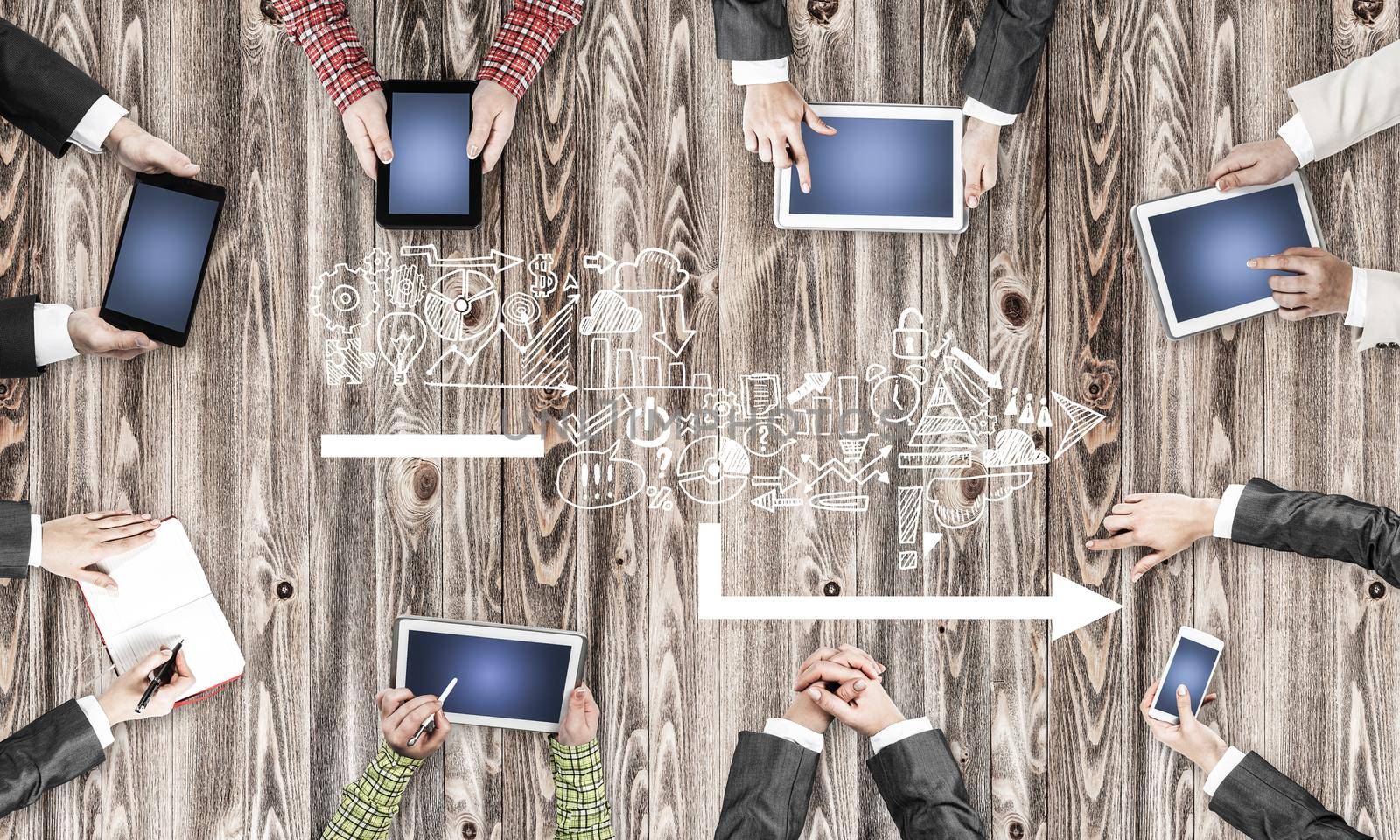 Group of people with devices in hands working together as symbol of networking and communication