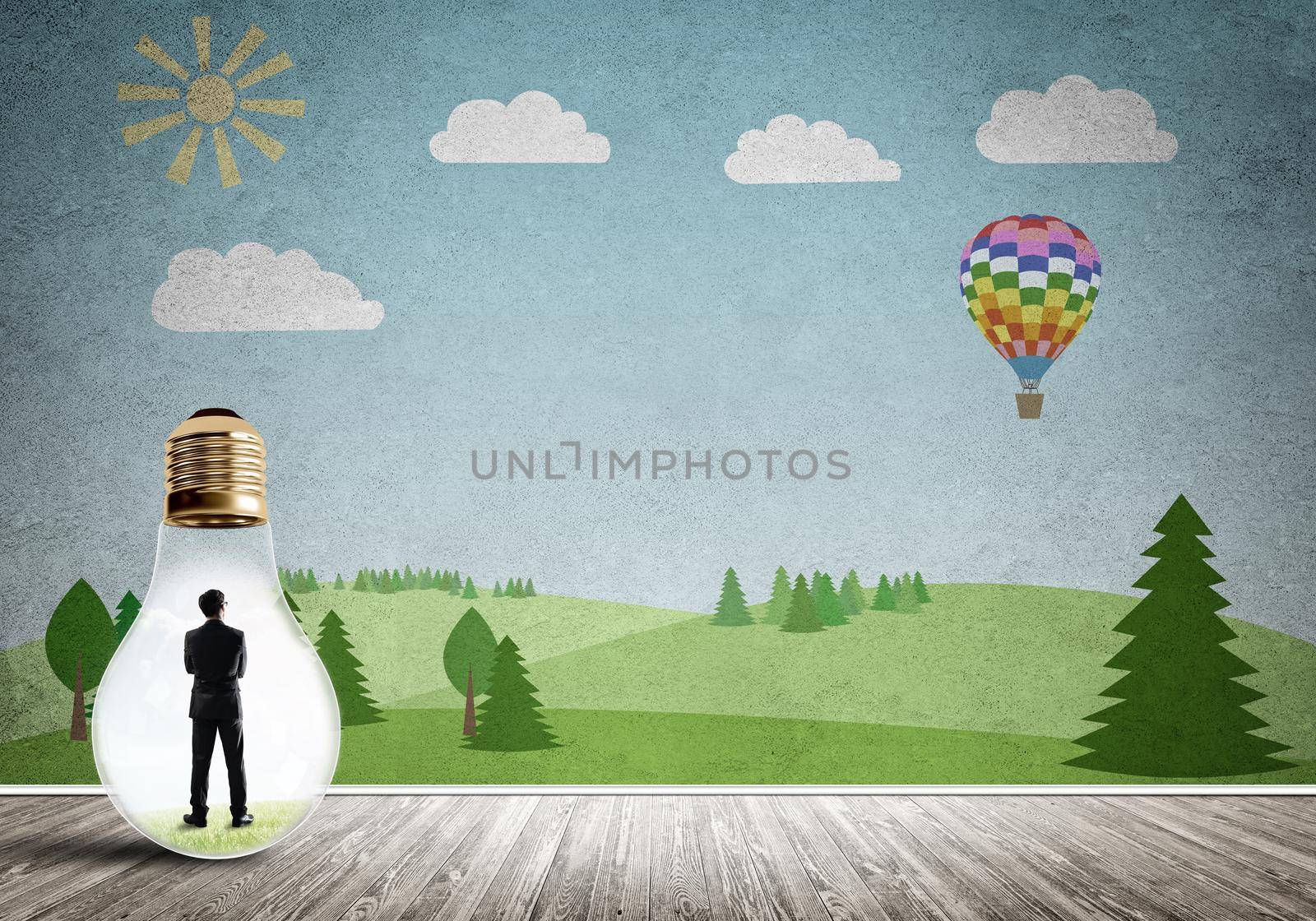 Businessman inside light bulb in room against nature drawn concept
